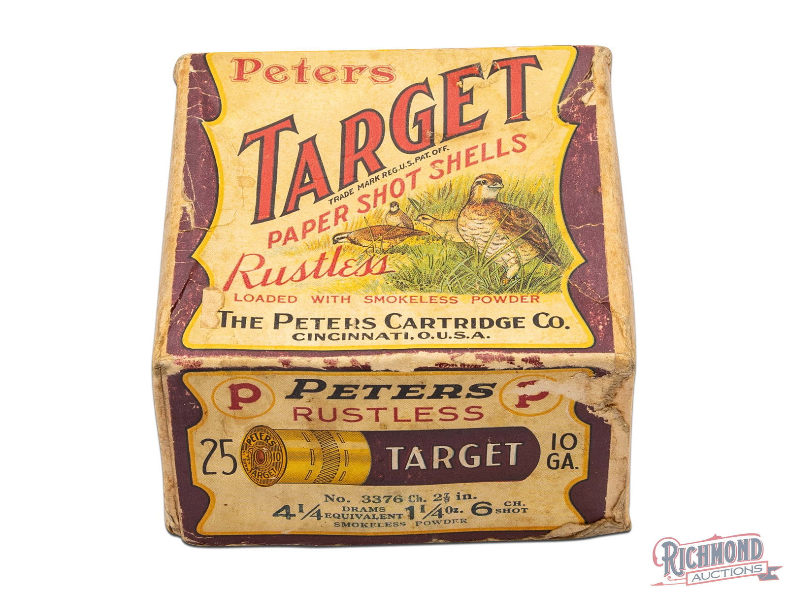 Peters Target 10 Gauge Rustless Paper Shot Shells Two Piece Box With Quail Graphic: This is an empty box of 10 gauge paper shot shells made by Peters Cartridge Co. This two piece box has white labels with dark red borders on the top, front, and back. The top label has a graphic of qu