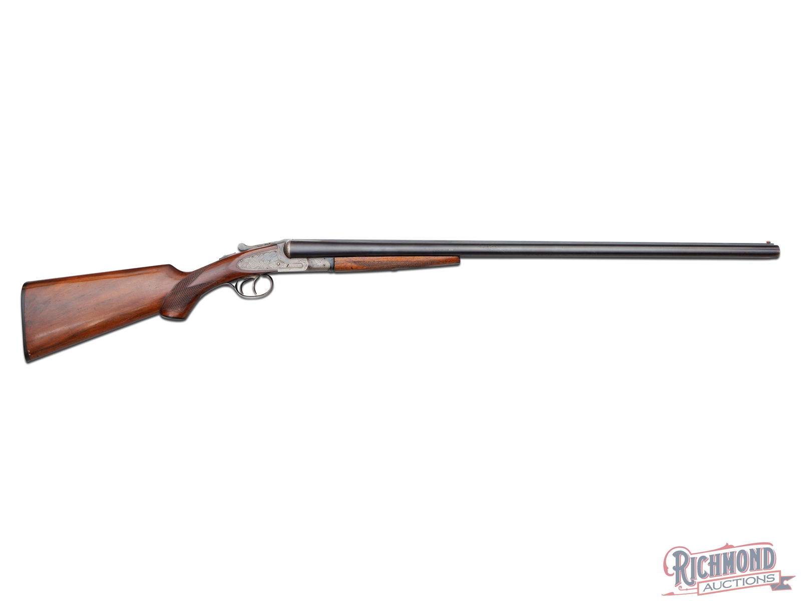 L.C. Smith Ideal Grade 12 Gauge Side by Side Shotgun: Made by Hunter Arms of Fulton, New York in 1945. Blued 30" London Steel barrels with Hunter Arms Address and "IDEAL GRADE" markings. Barrels have extractors, high rib sight plain, twin bead sight with