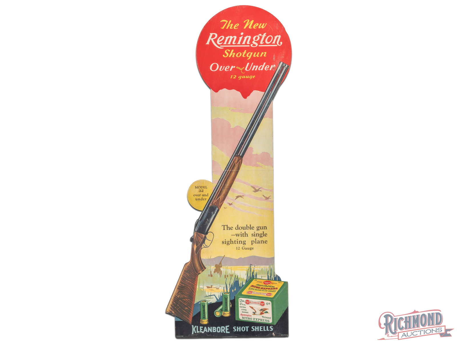Remington The New Over Under Shotgun 12 Gauge Cardboard Advertising Display Sign: Single sided die cut cardboard display has excellent color. The field has a horizontal fold line with small chips and two non factory holes near the tip of the gun barrel. The perimeter has areas of e