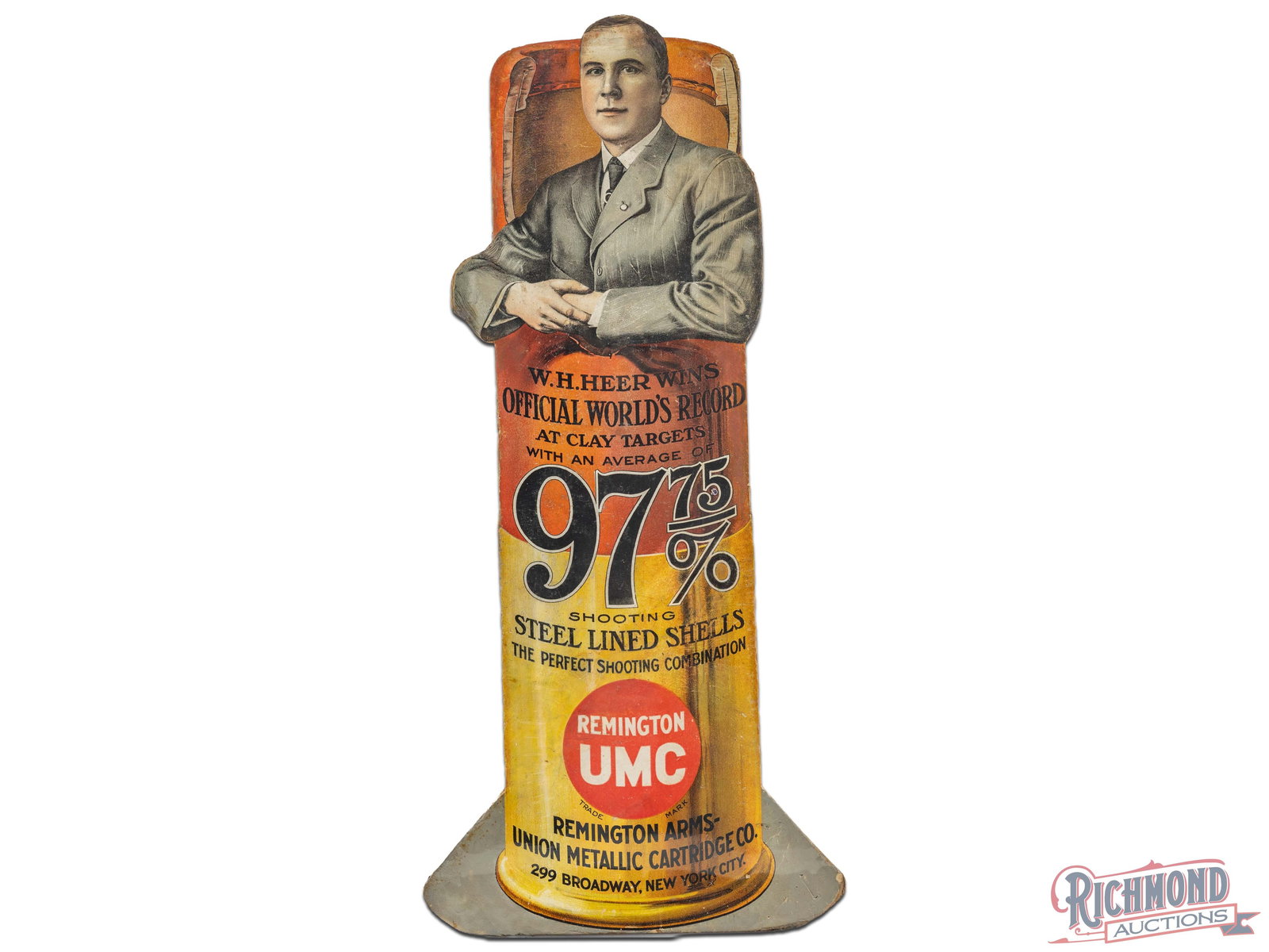 Scarce Remington UMC WH Heer World Record Clay Target 97.75% Average Die Cut Sign: This incredible Remington UMC advertising die cut features legendary trap shooter William "Silent Billy" Heer. Heer was a Remington salesman shooter, member of the famous UMC Southern Squad, and consi
