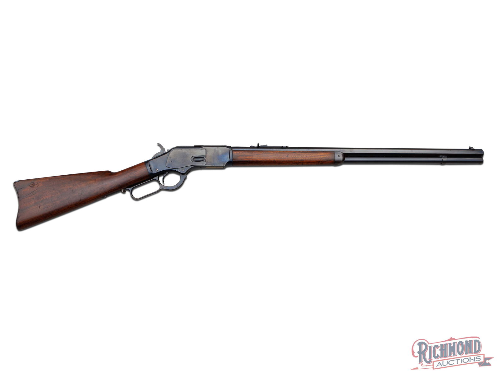 High Condition Winchester Model 1873 Lever Action Rifle in 44-40 Caliber: Made in 1917 by Winchester Repeating Arms Company. Blued 24" octagon rifled barrel with later style two line Winchester Address with Winchester Proofmark and .44 W.C.F. caliber markings at breech. Blu