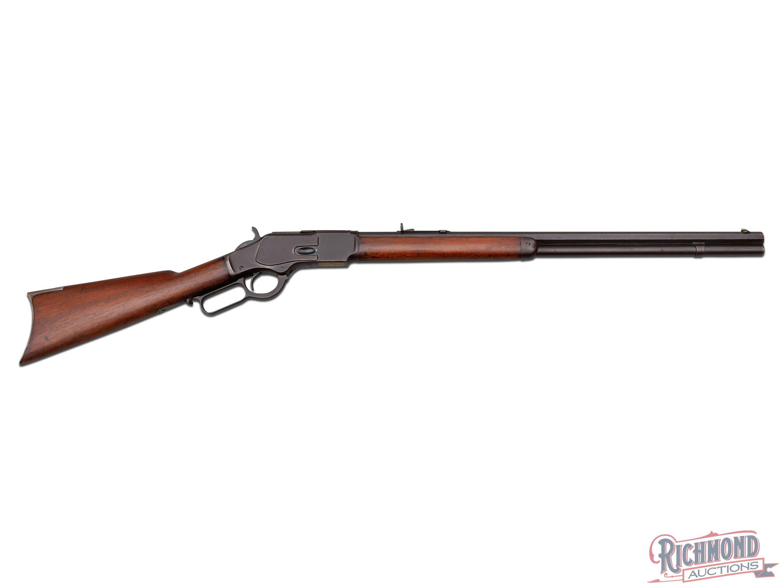 Winchester Model 1873 Lever Action Rifle in 38-40 Caliber: Made in 1892 by Winchester Repeating Arms Company. Blued 24" octagon rifled barrel with King's Improvement two line Winchester Address with .38 W.C.F. caliber marking at breech. Blued full tubular mag