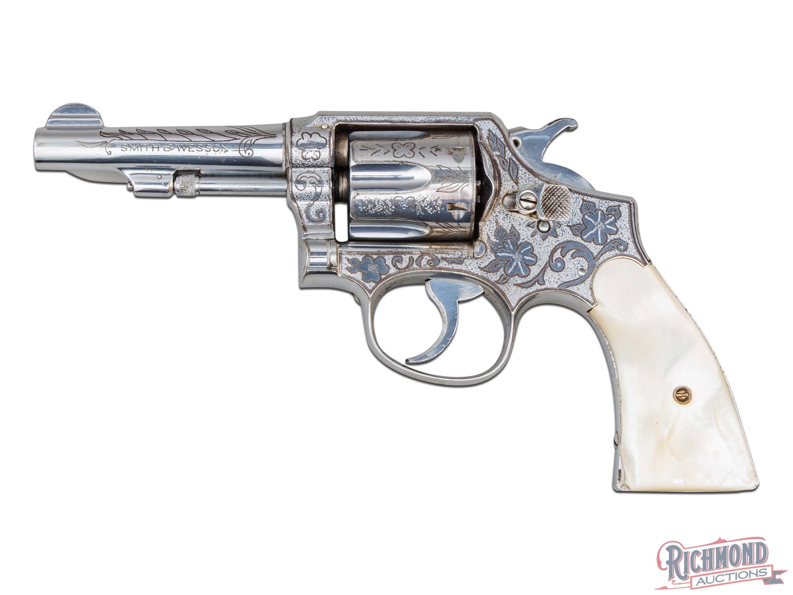 Pre-War Smith & Wesson M&P Model of 1905 Engraved .38 SPL Revolver with Mother of Pearl Grips: Manufactured by Smith & Wesson between circa late 1930's. This Military & Police model 1905 is the 4th change. Features a 4" barrel with rear integrated notch and half- moon blade front sight. Two-lin