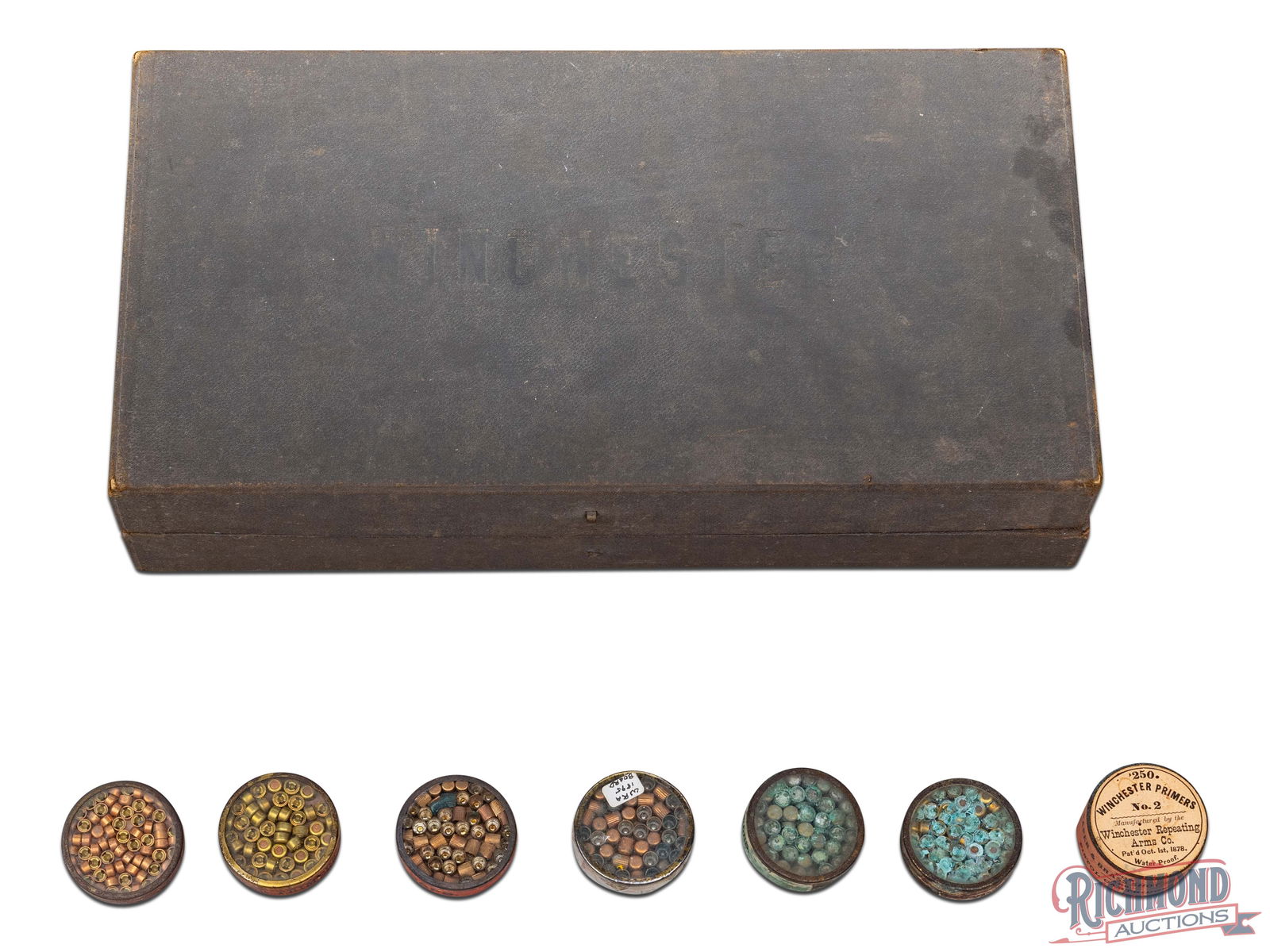 Circa 1890 Vintage Winchester Shotshell and Primer Salesman's Kit: Made by Winchester Repeating Arms circa 1890. Kit features 7 loaded window tins with spaces for 6 brass shells and 10 paper shells. Kit comes with 7 unattached window tins with shells missing. Black c