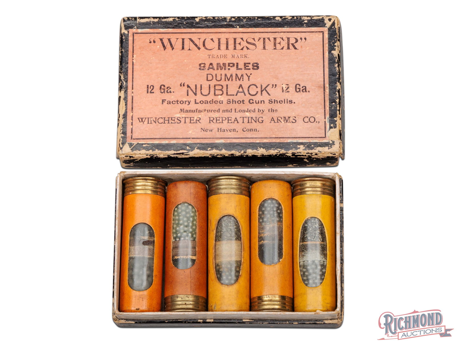 Winchester Nublack Shotshell Salesman Sample: Made by Winchester Repeating Arms circa 1930. Kit features 5 loaded window shells with "Nublack" shell brand in two piece cardboard container with pink label and black "Winchester" logo with black she