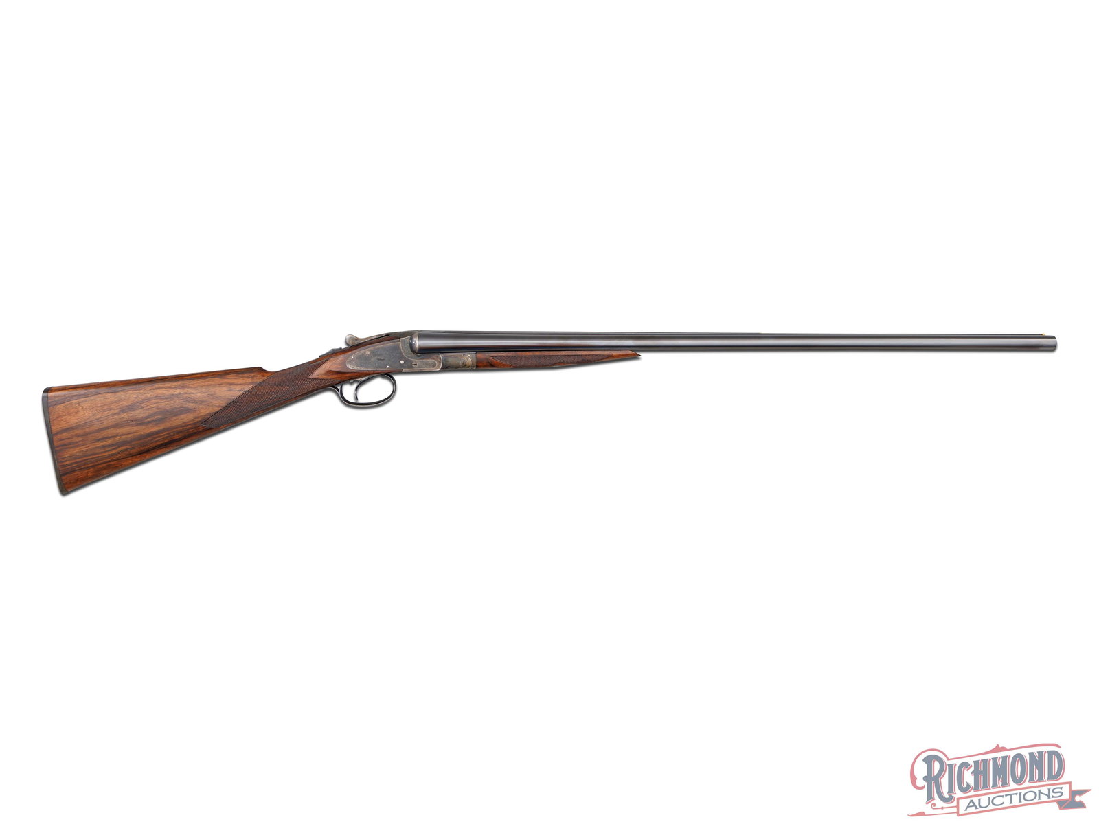Scarce L.C. Smith No. 2 Grade Side By Side Shotgun in 20 Gauge: Made by the Hunter Arms Company in 1907. Gun has blued 30" Crown Steel barrels with 2-3/4" chambers, matted sighting plane with twin bead sights and ejectors. Gun has "Hunter Arms Company Fulton NY" a