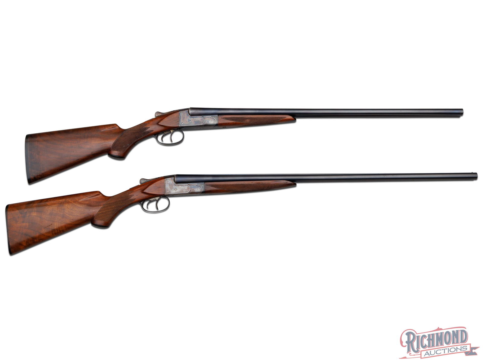 High Condition Pair Of NID Ithaca Field Grade Side By Side Shotguns In Rare 28 Gauge: Both made by The Ithaca Gun Company in 1940. Guns are six serial numbers apart. Gun No. 1(serial number 466873) has blued 26" Fluid Steel barrels with 2-3/4" chambers, matted rib with bead sight and e