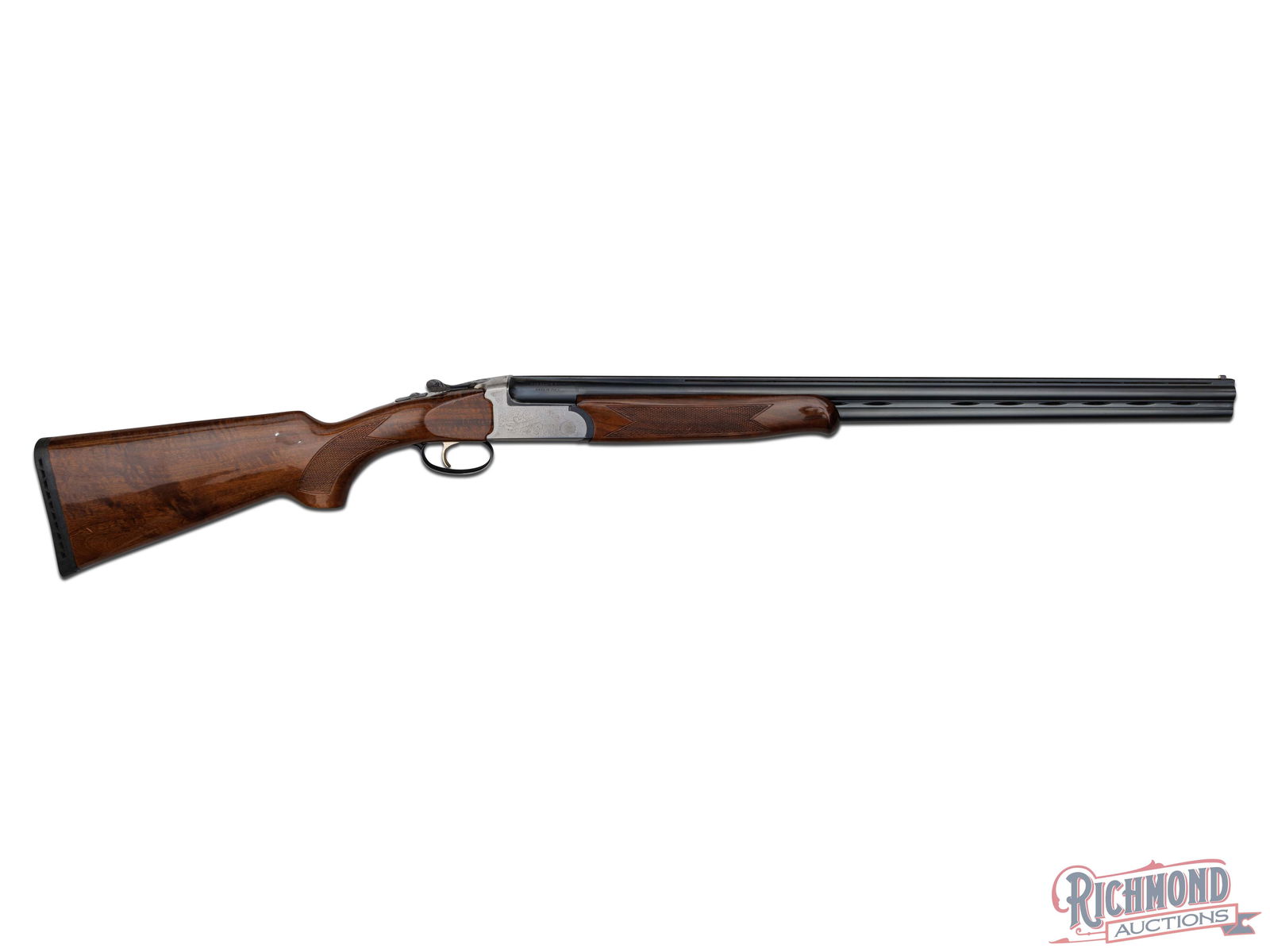 Italian Made Charles Daly Deluxe Over/Under Shotgun in 28 Gauge: Made in Italy (probably by Brixia and Sabatti) for Charles Daly circa 1990 and imported by Outdoor Sports of Dayton, Ohio. Blued 26" fluid steel barrels with Charles Daly import marks and "Made in Ita
