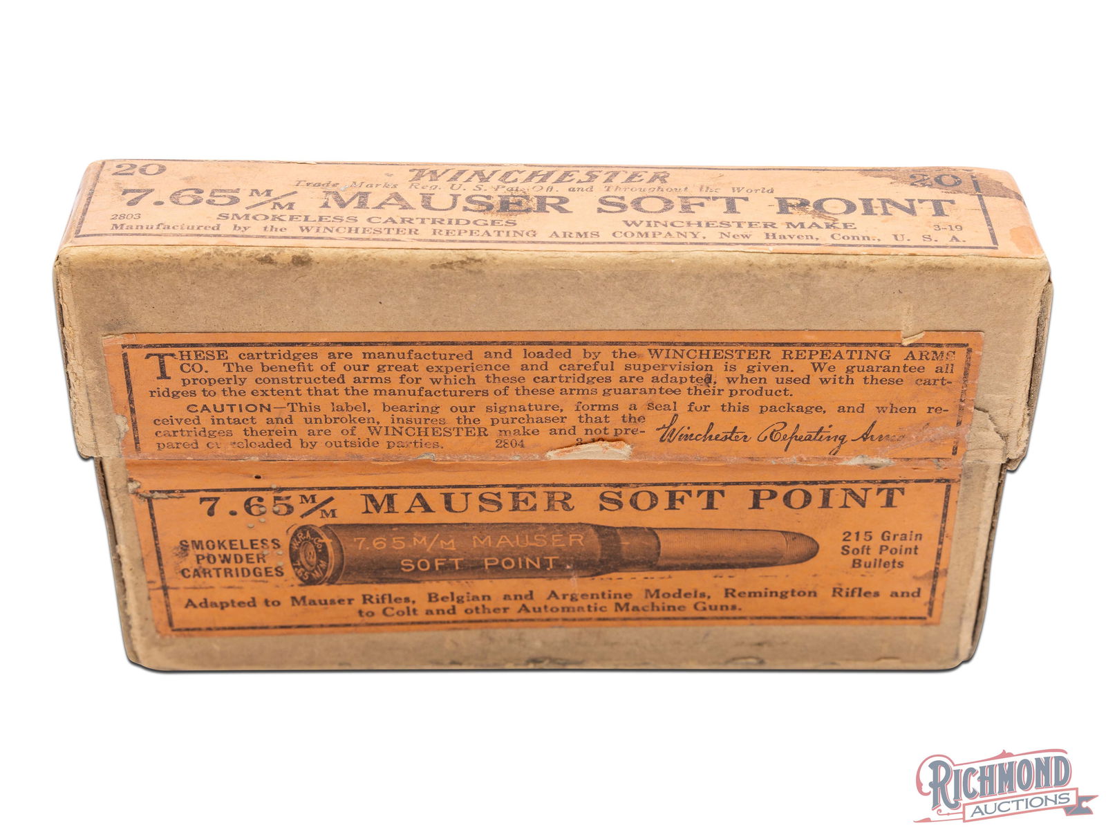 Full Winchester 20 Round Two Piece Box of 7.65 m/m Mauser Soft Point: Manufactured by Winchester Repeating Arms Co., this two piece box contains 20 7.65 m/m Mauser soft point cartridges. It has an orange label on the top, front, and sides. The front label has an image o