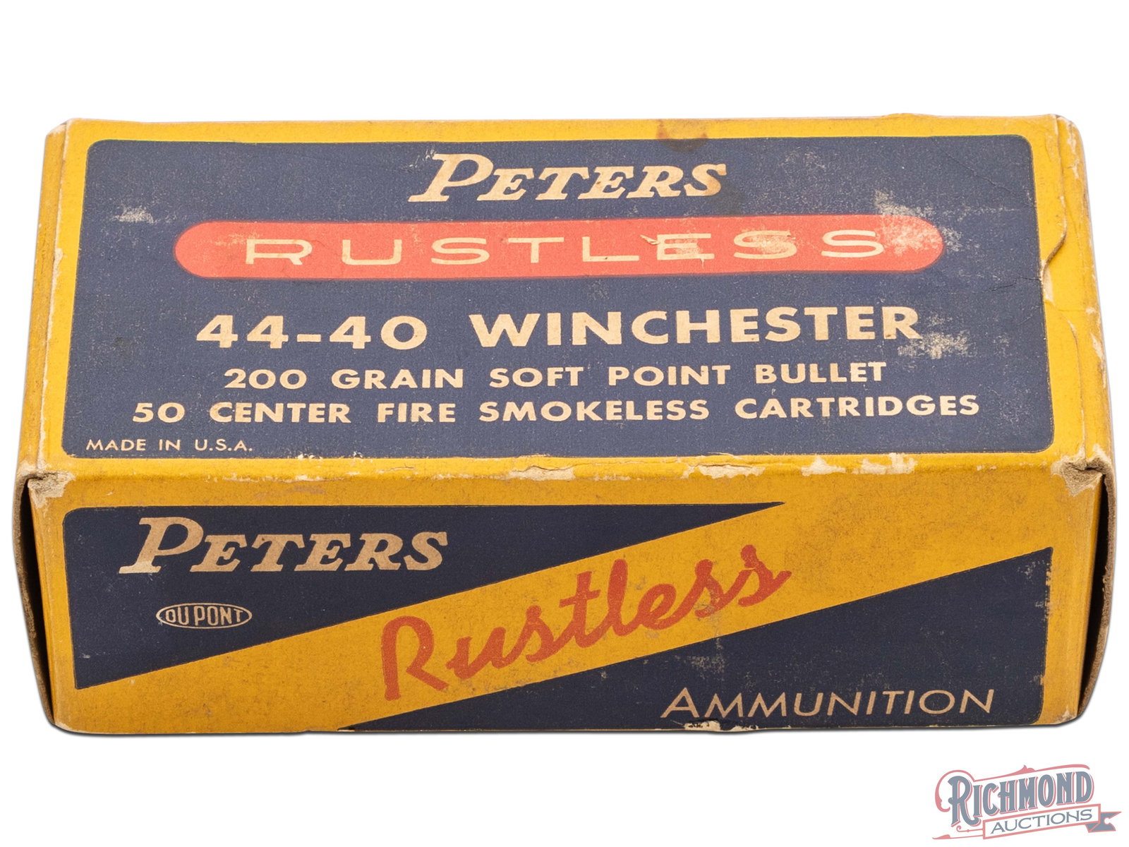 Peters Rustless 44-40 Winchester Soft Point bullet Collectors Box: This is an empty box of Peters Rustless 44-40 Winchester Center Fire Smokeless Cartridges. The box has a navy blue and yellow color with "Rustless" in red. The back of the box has the description of "
