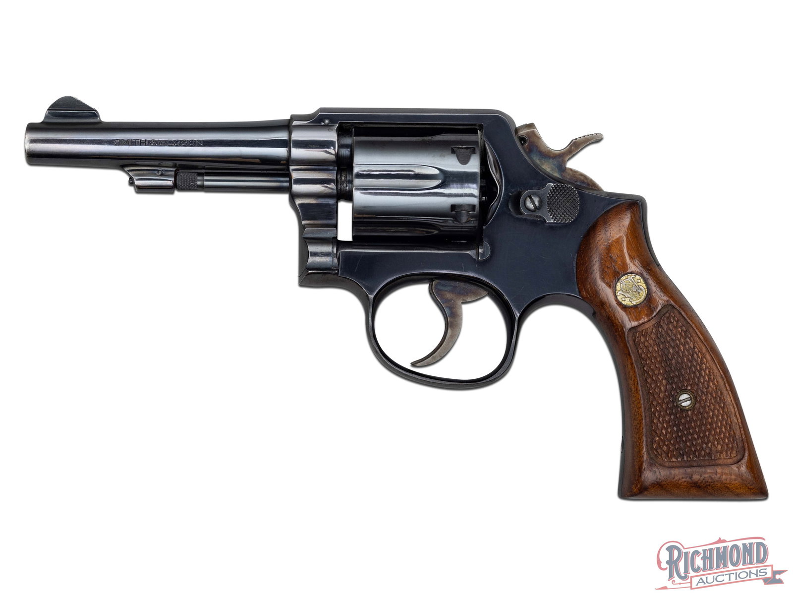 Smith & Wesson Model 10-7 .38 Special Double Action Revolver: Manufactured by Smith & Wesson circa 1977. Features a 4" pinned barrel with rear integrated stop strap notch and blade front sight. Barrel stamped "SMITH & WESSON" on the left and "38 S&W SPECIAL CTG.