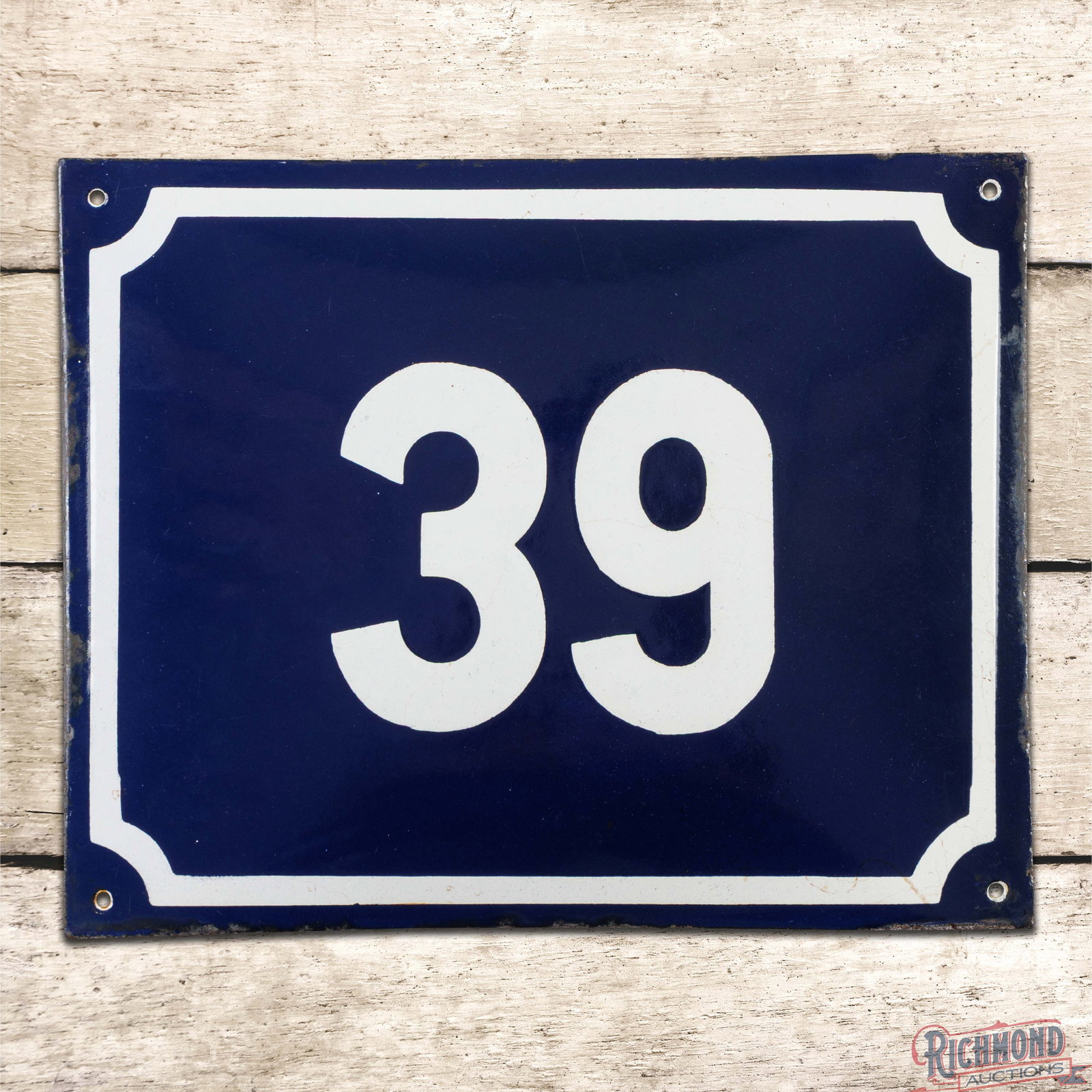 Number #39 Convex Single Sided Porcelain Sign: SSP (single sided porcelain) pillow sign has excellent color and gloss. The display has minor surface imperfections with light wear and small chips along the outer edges. The sign was likely used to d