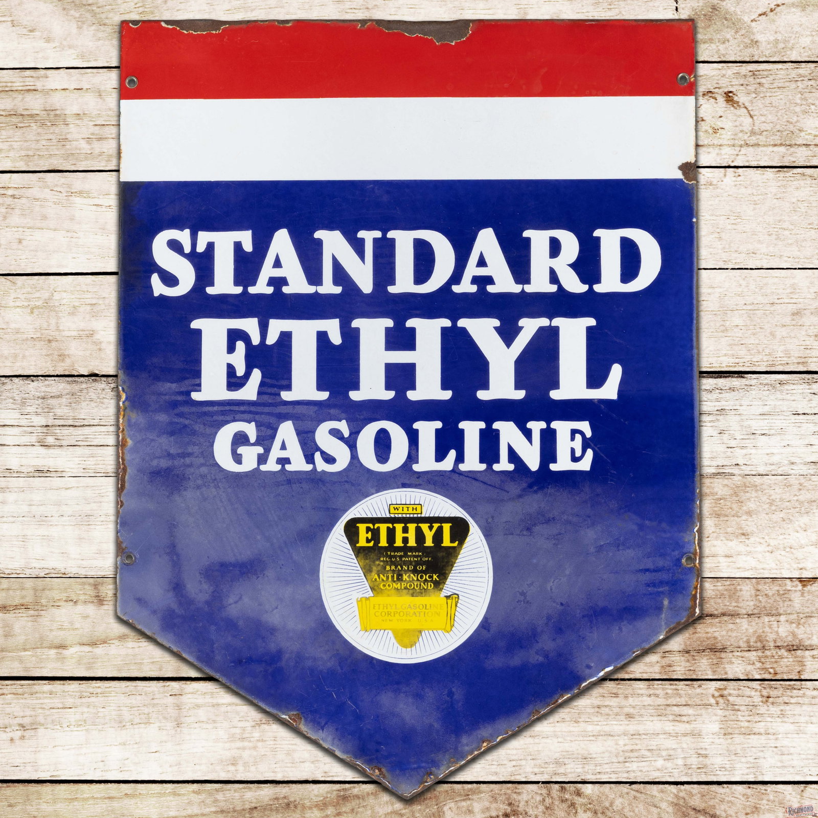 Standard Ethyl Gasoline Die Cut Double Sided Porcelain Sign w/ Logo: DSP (double sided porcelain) die cut sign has good color and moderate gloss. The display has light surface wear with cloudiness and wash, which is more pronounced in the lower fields. The perimeter ha