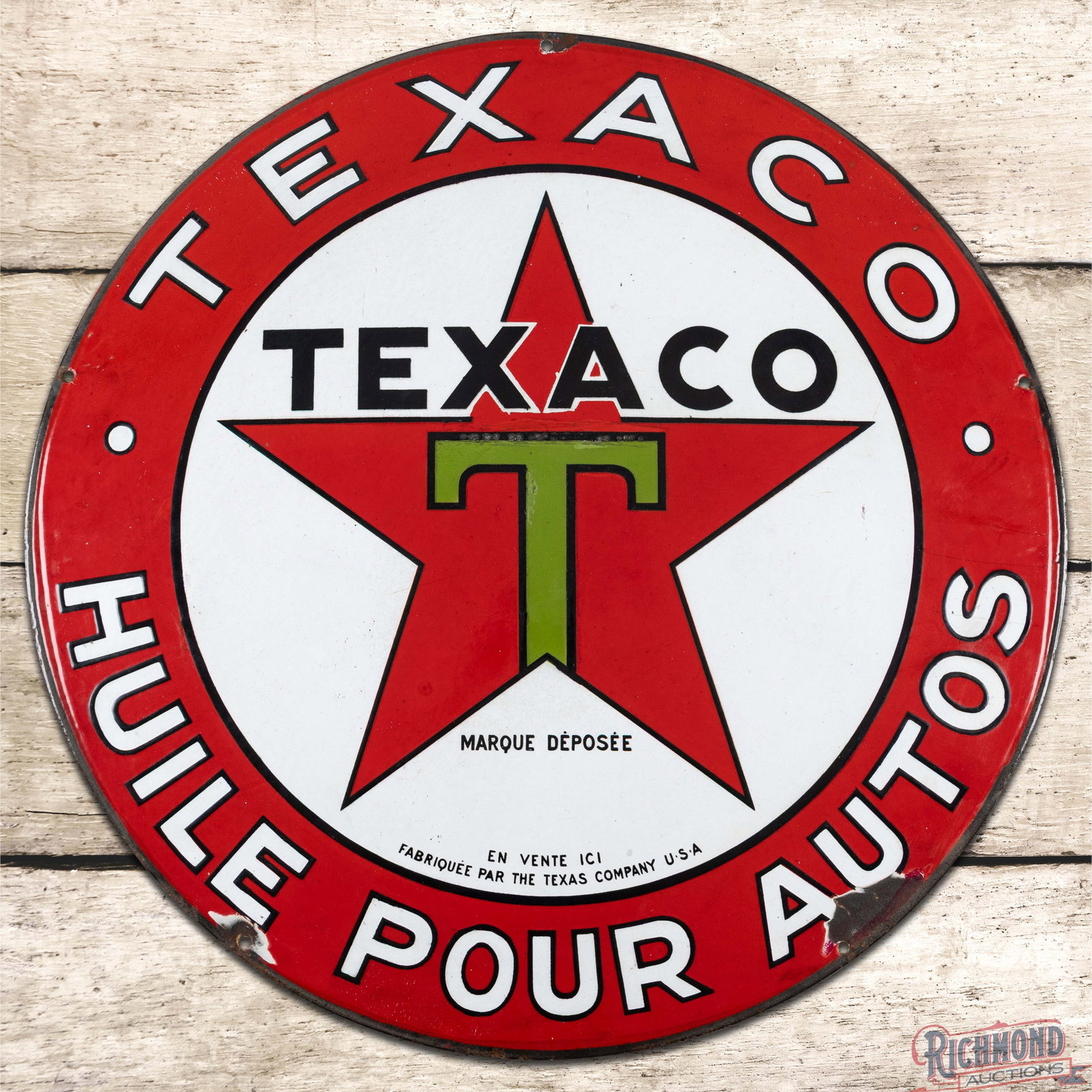 Texaco Huile Pour Autos 22" Convex Single Sided Porcelain Sign "Black T": SSP (single sided porcelain) convex sign has very good color and gloss. The display has light wear with factory blemishes at the top of the "T" logo and the outer fields. The perimeter has a larger ch