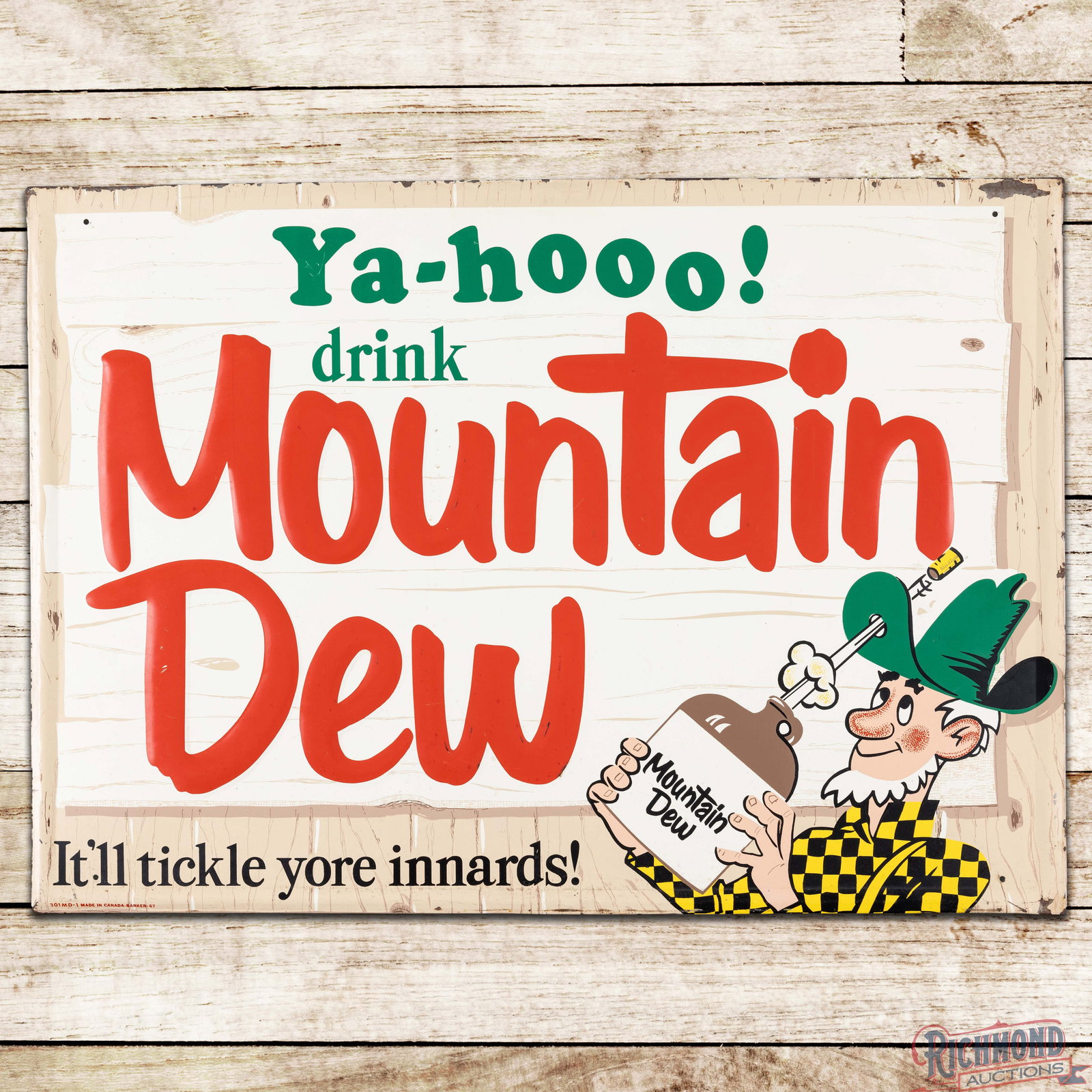 1967 Ya-Hooo! Drink Mountain Dew "It'll Tickle Yore Innards!" Emb. Single Sided Tin Sign w/: SST (single sided tin) embossed self-framed sign has excellent color and gloss. The field is very clean overall with light wear and small scuffs to the lettering. The perimeter has paint chips along t