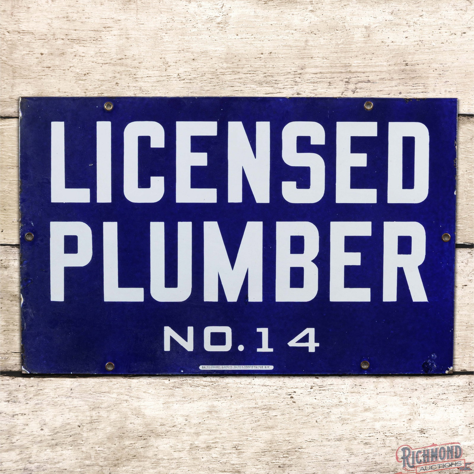 Licensed Plumber No. 14 Single Sided Porcelain Sign: SSP (single sided porcelain) sign has very good color and gloss. The sign exhibits light surface wear throughout with factory imperfections in the outer fields. The perimeter has small chips along the
