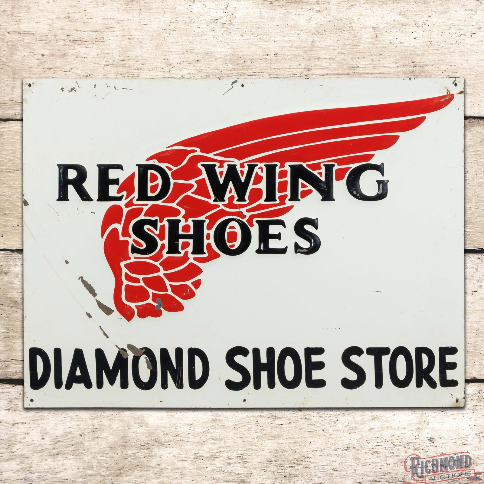 Red Wing Shoes Diamond Shoe Store Emb. Single Sided Tin Sign w/ Logo: SST (single sided tin) embossed sign has good color and shine. The field exhibits fine scratches with paint chips in the lettering and lower left fields. The perimeter has small bends with minor paint