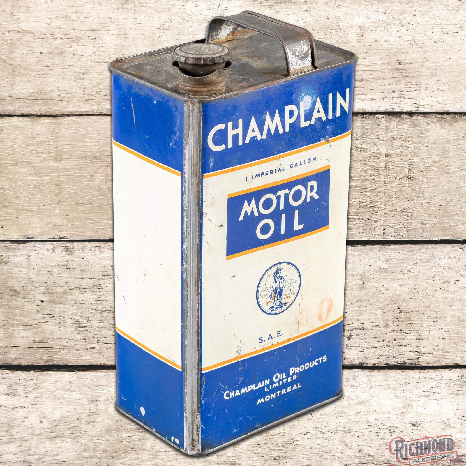 Champlain Oil Products 1 Imperial Gallon Can w/ Logo: Empty imperial gallon metal can has good color and shine. Side #1 has surface wear with fine scratches, slight fading to the orange paint and a areas of discoloration in the "L" in the upper lettering