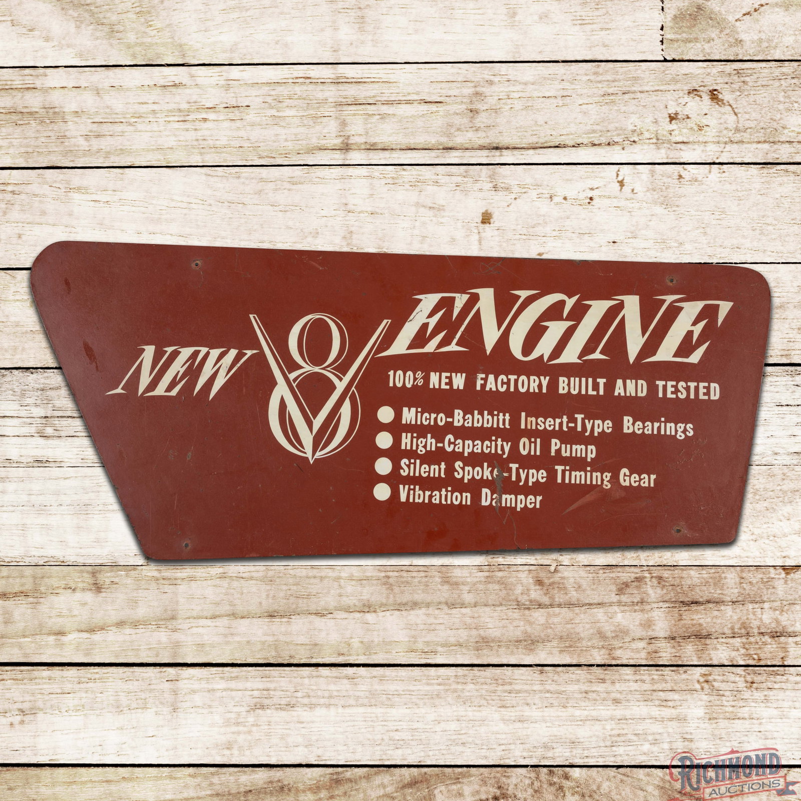 Studebaker New V8 Engine w/ Champion Engine Reverse DS Masonite Die Cut Sign: Double sided masonite sign has good color. The Champion Engine side has light wear in the fields with minor spotting in the outer fields. The reverse with "New V8 Engine" lettering has additional surf
