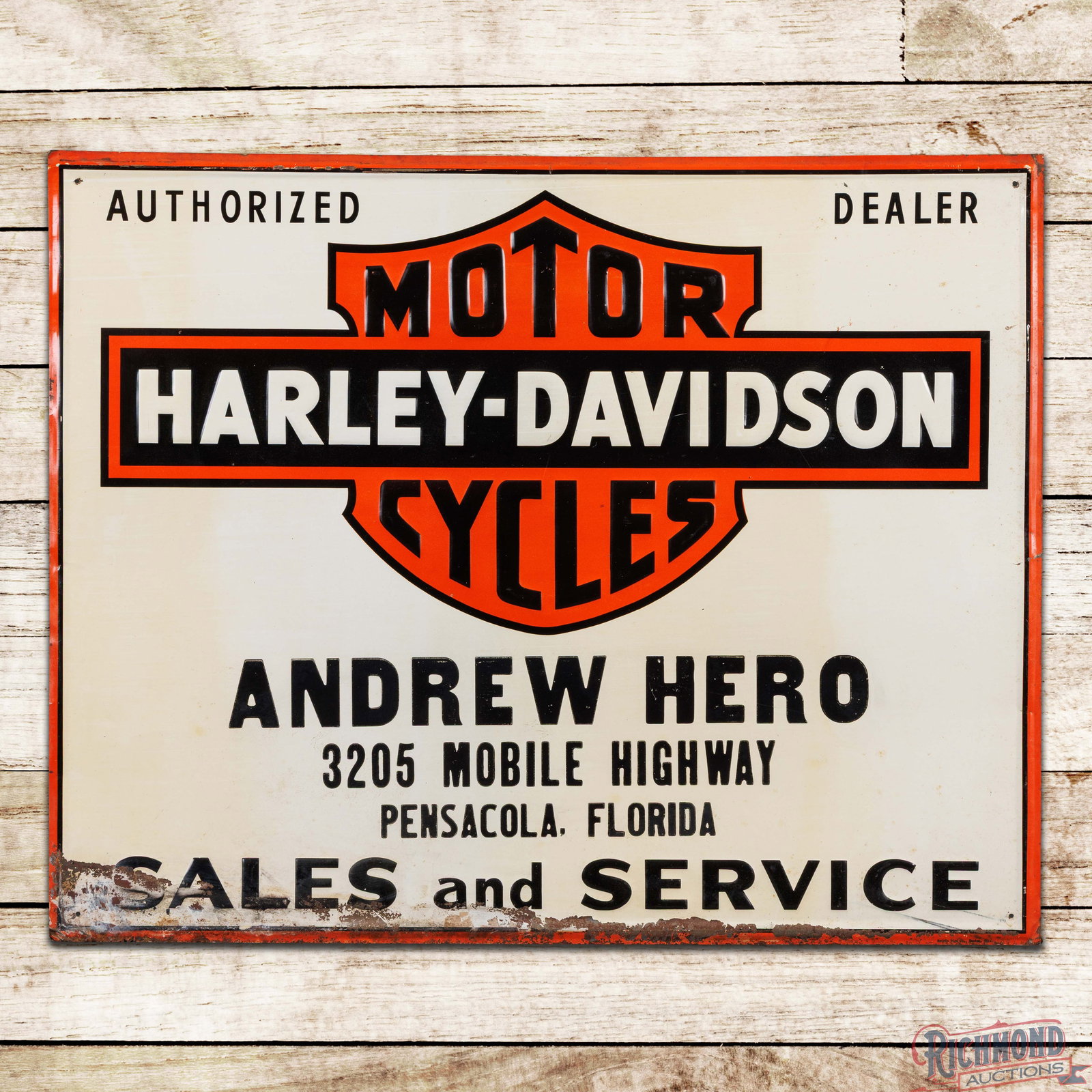 Harley Davidson Motorcycles Authorized Dealer Sales Service Emb Single Sided Tin Sign Pensacola FL: SST (single sided tin) embossed self-framed sign has excellent color and shine. The field has light surface wear with areas of toning and small indentations. The perimeter has small bends along the ou