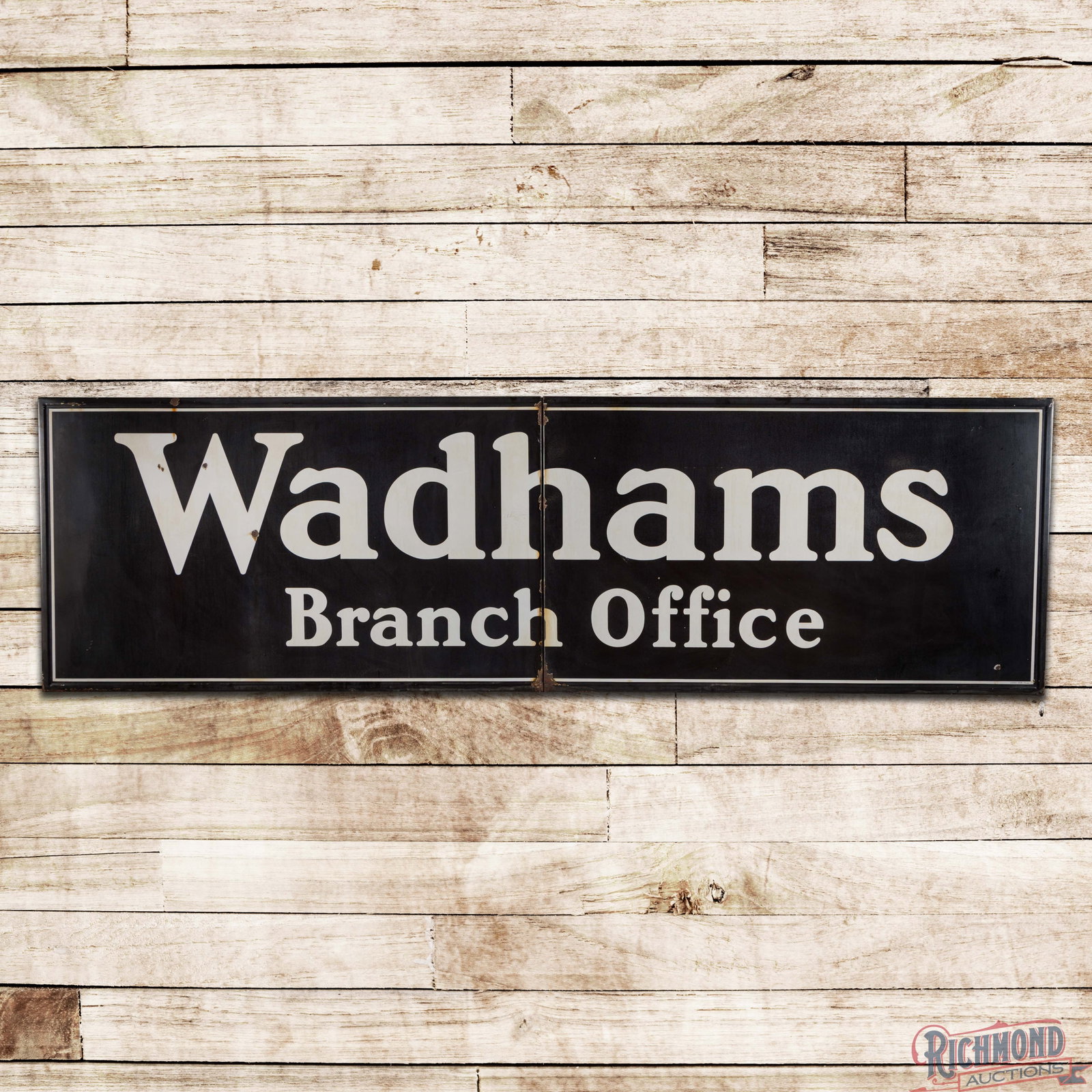 Wadhams Oils Branch Office 12' Single Sided Porcelain Sign "Large": SSP (single sided porcelain) two-piece self-framed sign has good color. The sign has cloudiness to the black porcelain enamel with slight discoloration to the white porcelain enamel. The field exhibit