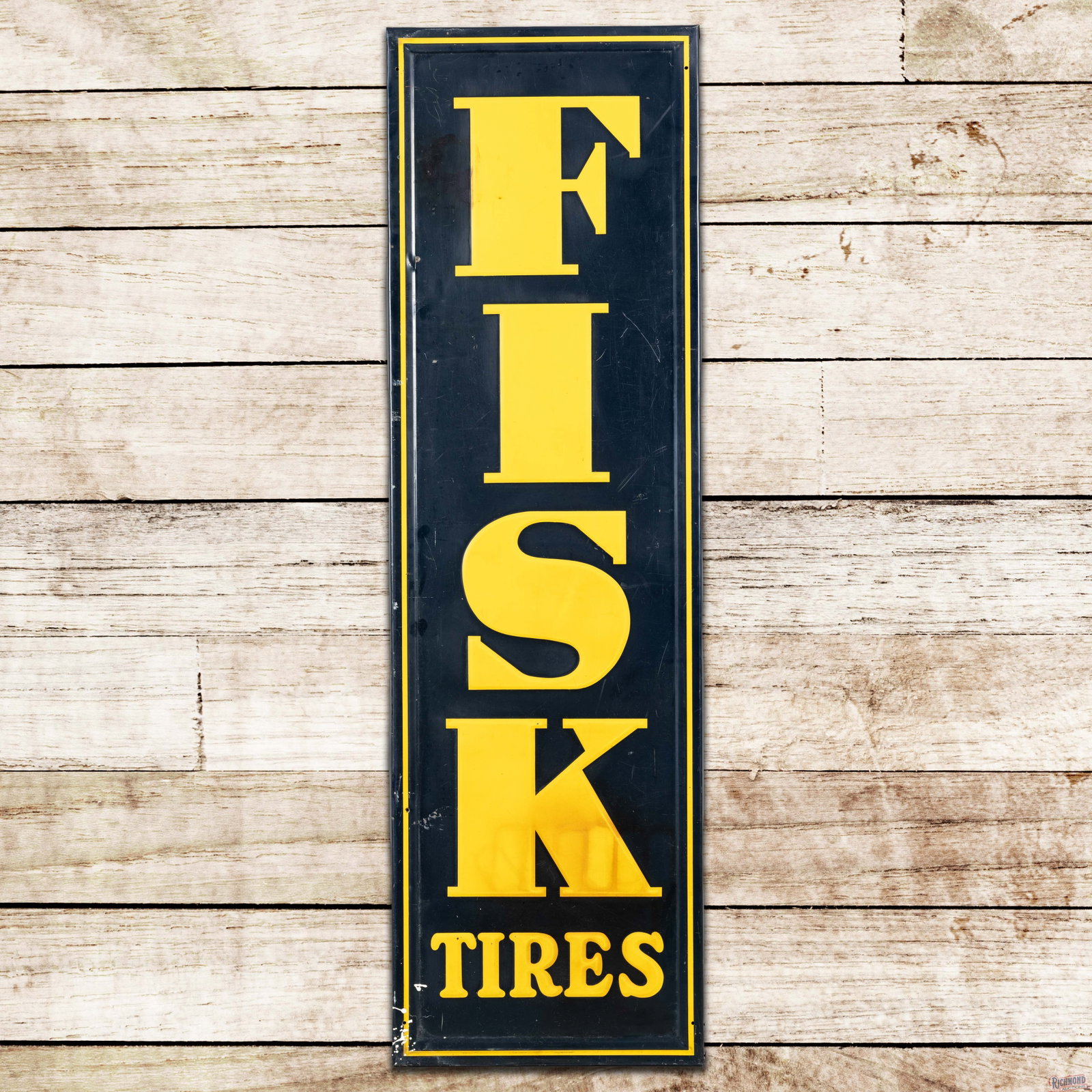 Fisk Tires 5' Emb. Single Sided Tin Sign: SST (single sided tin) embossed self-framed sign with the factory wooden frame has good color and shine. The field has fine scratches with toning and discoloration in the lower lettering and upper lef