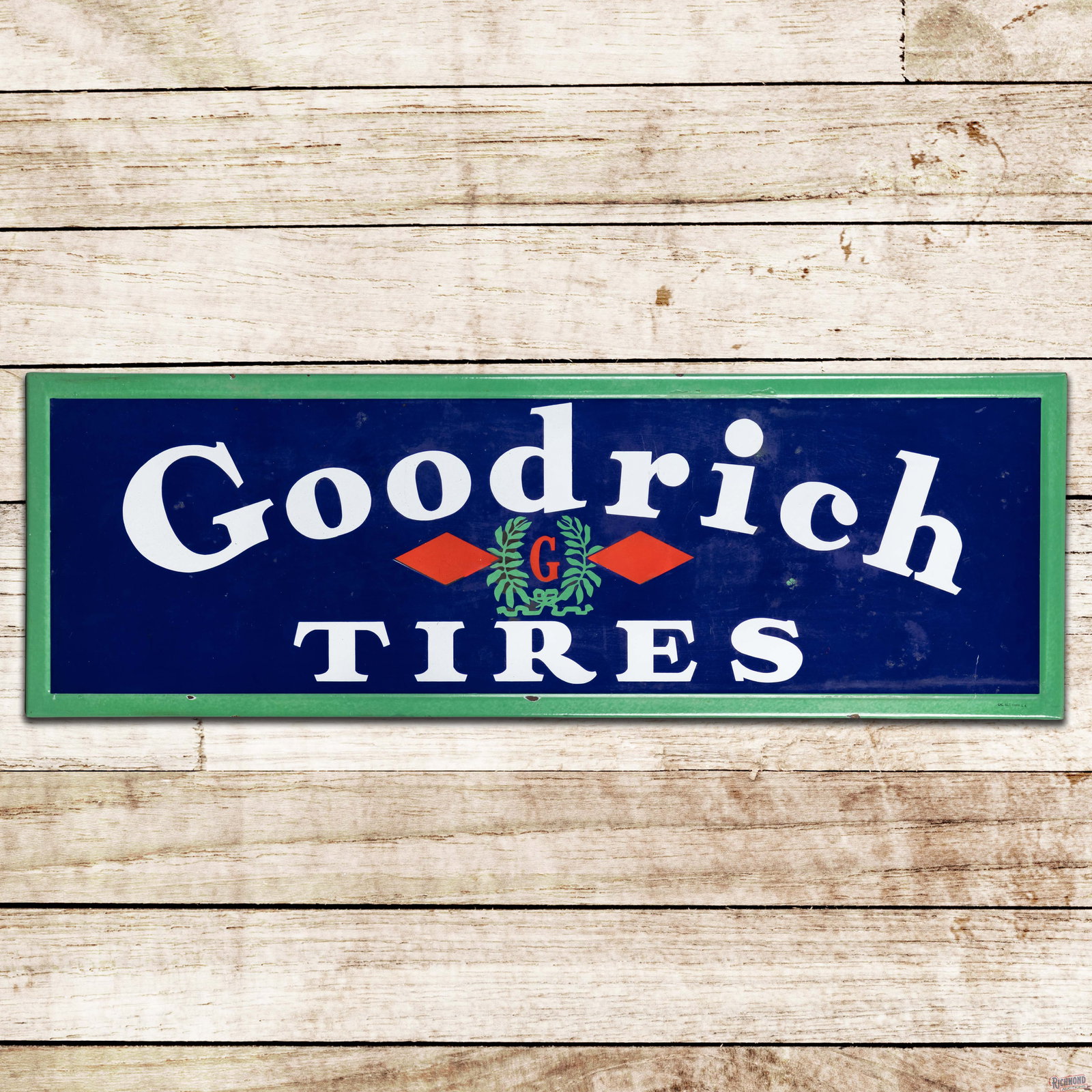 Goodrich Tires 5' Self-Framed Single Sided Porcelain Sign w/ Logo: SSP (single sided porcelain) self-framed sign has good color and gloss. The field has factory blemishes with areas of surface wear and cloudiness. The perimeter chips with discoloration along the gree