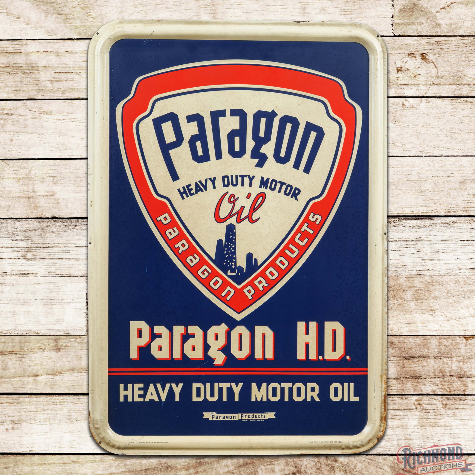 Paragon Heavy Duty Motor Oil Emb. Single Sided Tin Sign: SST (single sided tin) embossed self-framed sign has good color and shine. The sign exhibits toning throughout with spotting to the white painted areas and a few fine scratches in the lower outer fiel