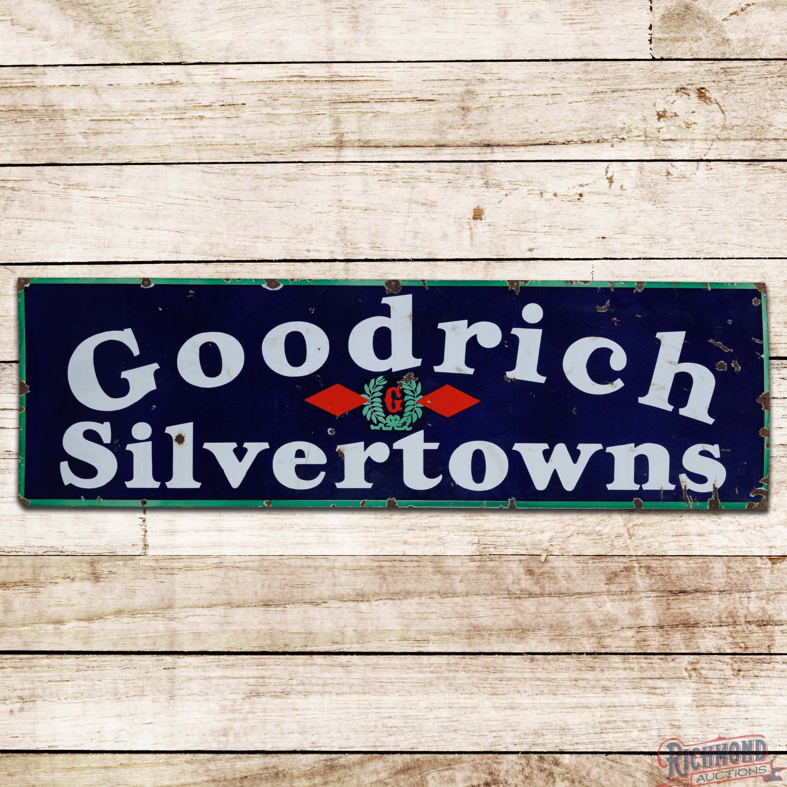 Goodrich Silvertowns Tires 5' Single Sided Porcelain Sign w/ Logo: SSP (single sided porcelain) sign has good color and gloss. The field has surface wear with chips and crazing. The perimeter has similar wear with a tiny bend on the lower left and upper right corners