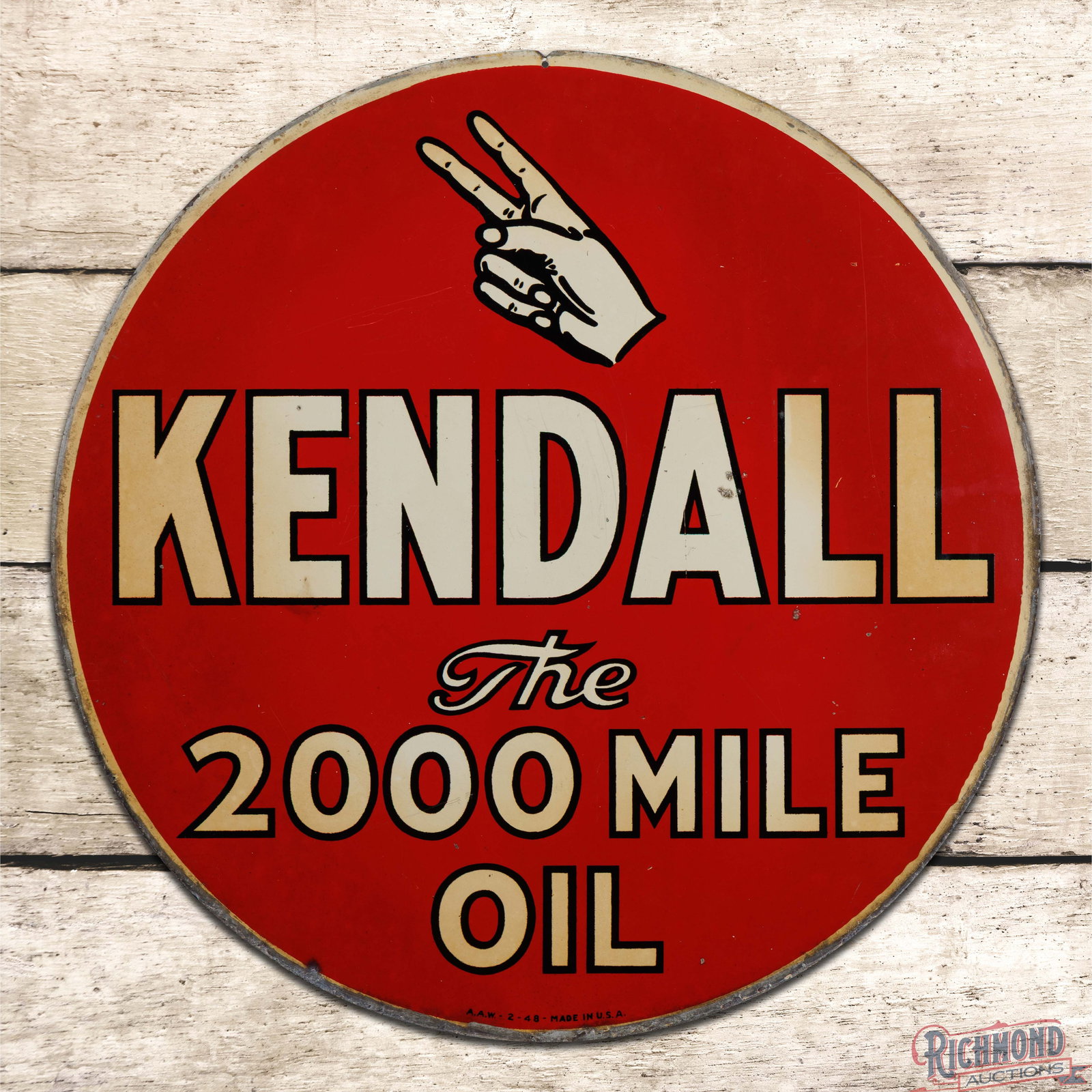 1948 Kendall The 2000 Mile Oil 24" Double Sided Tin Sign w/ Logo: DST (double sided tin) sign has good color and shine. The display has toning with fine scratches, paint chips, and a slight vertical bend that proceeds from the "D" in Kendall to the lower edge. The p