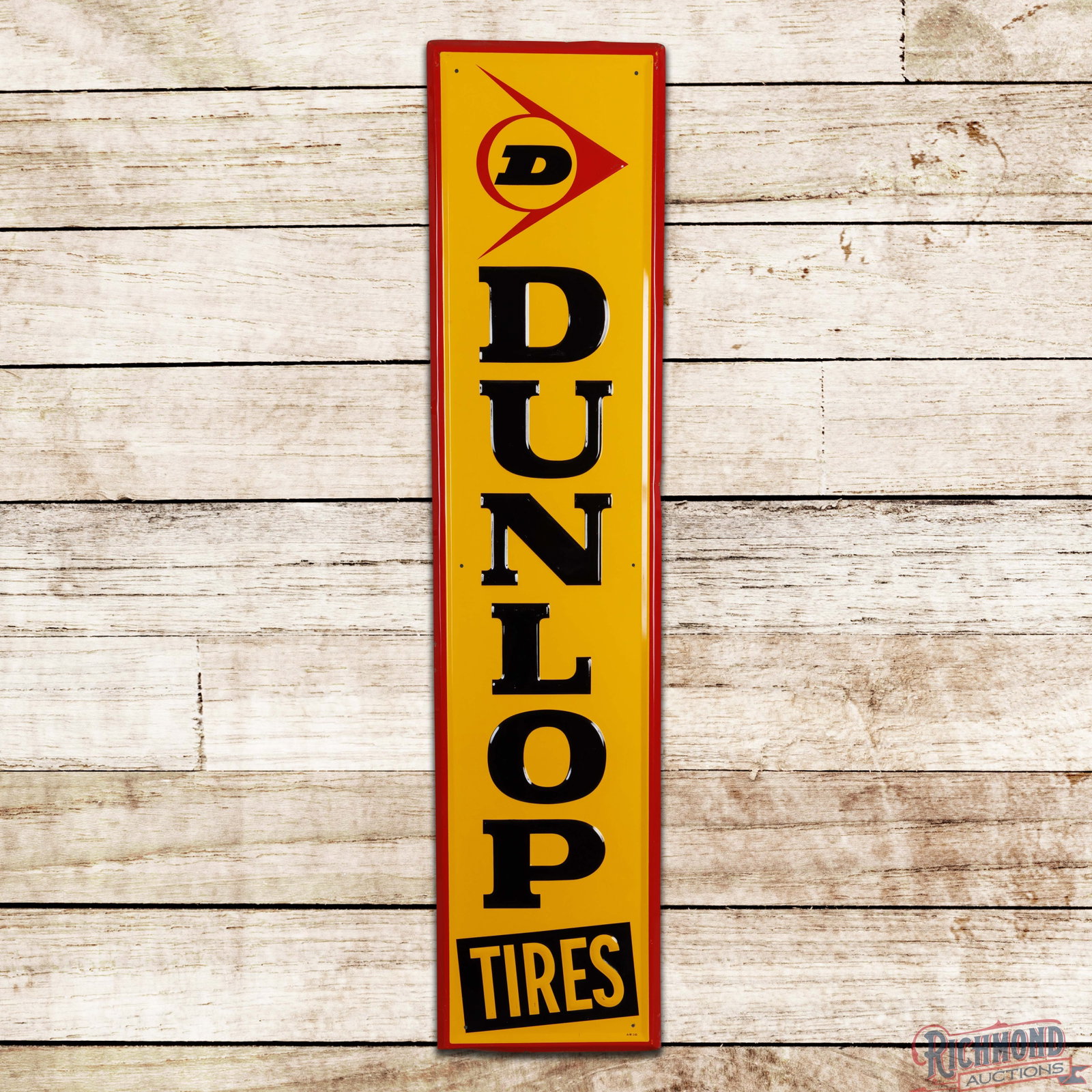 1965 Dunlop Tires 5' Emb. Single Sided Tin Sign: SST (single sided tin) embossed self-framed sign has excellent color and shine. The display has light wear to the embossed lettering and a few tiny paint chips in the lower "Tires" lettering. The peri