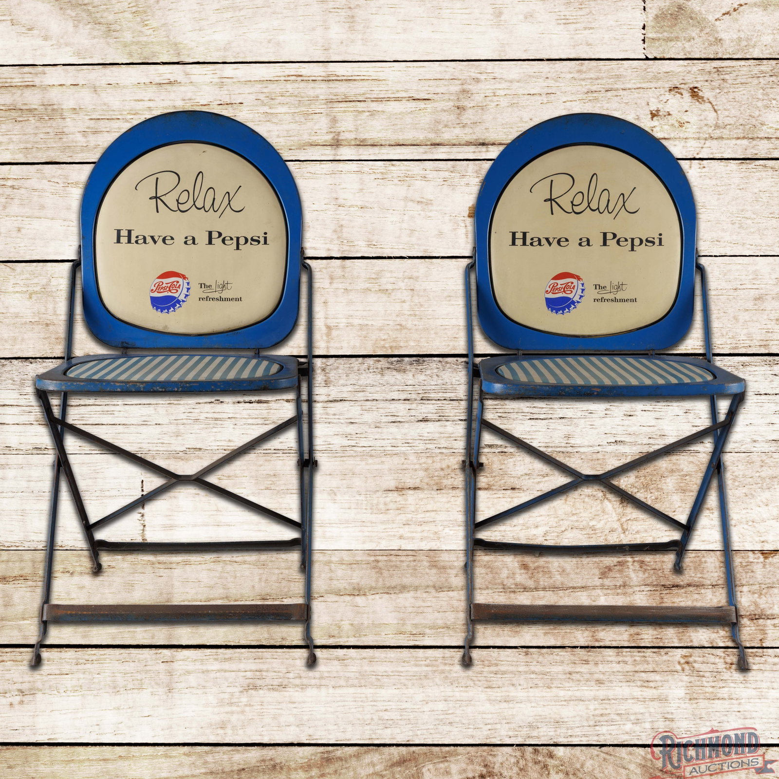 Group of Two Pepsi Cola Metal Folding Chairs: Group of two Pepsi Cola metal advertising chairs. Both chairs feature original paint with the original inserts. They show light wear throughout with areas of paint loss and oxidation. 32" H x 16" W x 