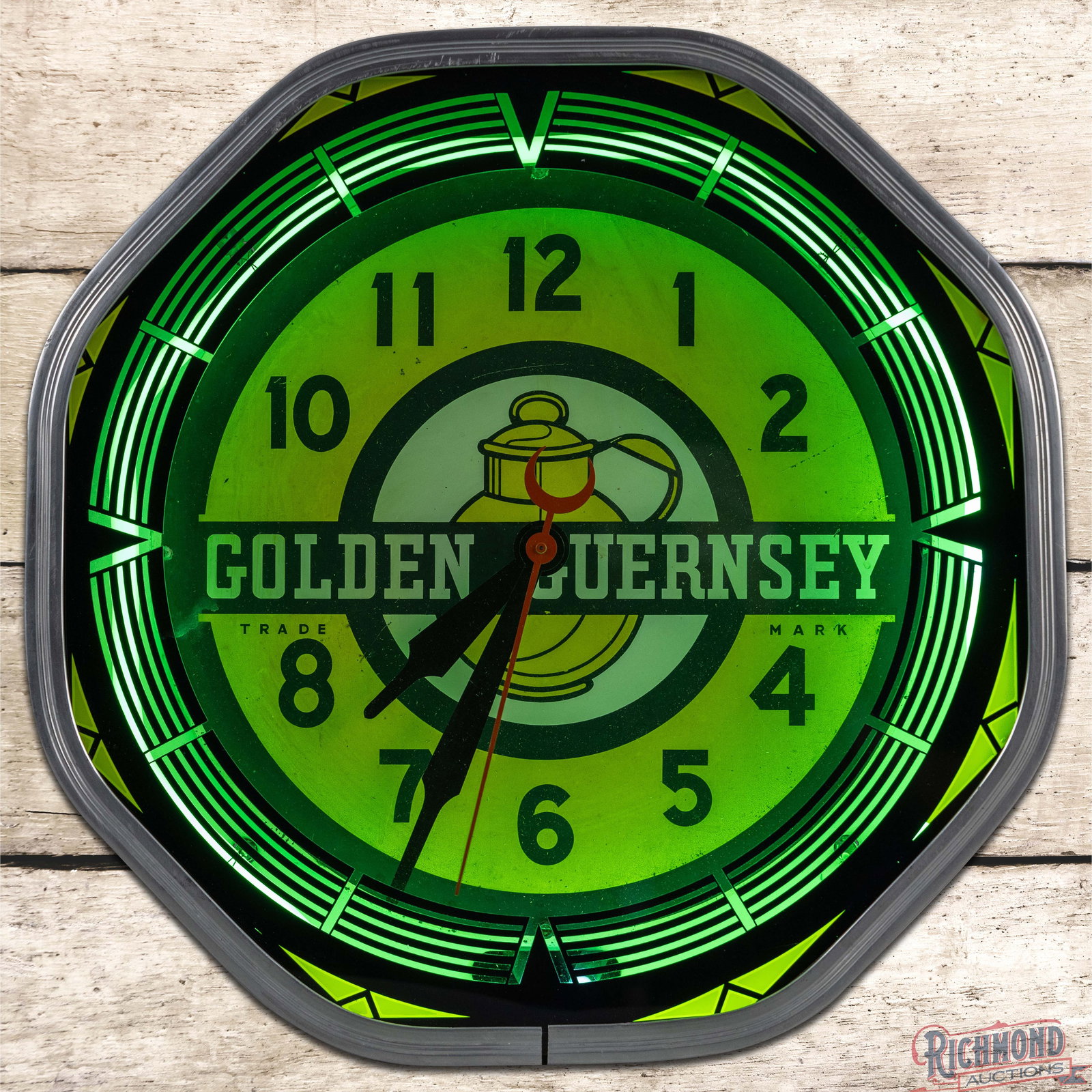 Golden Guernsey 18" Octagon Neon Advertising Clock w/ Logo: Octagon neon advertising clock works properly. The inner face has very good color with fine scratches and small paint chips. The hands and outer glass are in very good condition. The metal body retain