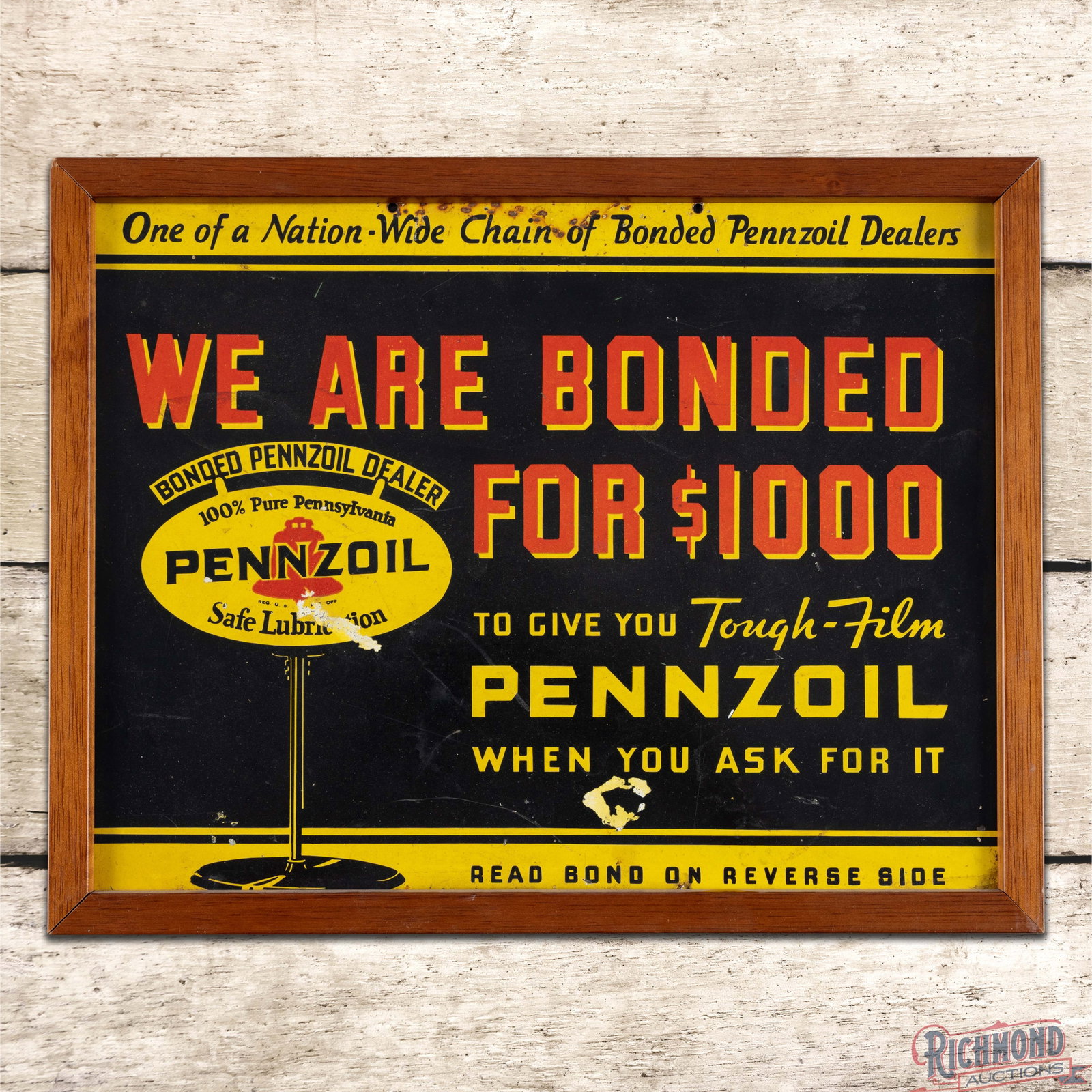 Pennzoil We are Bonded Single Sided Tin Sign Framed: SST (single sided tin) sign with an added wooden frame has good color and shine. The display has fine scratches and paint chips. The perimeter has minor oxidation along the upper edges. The wooden fra
