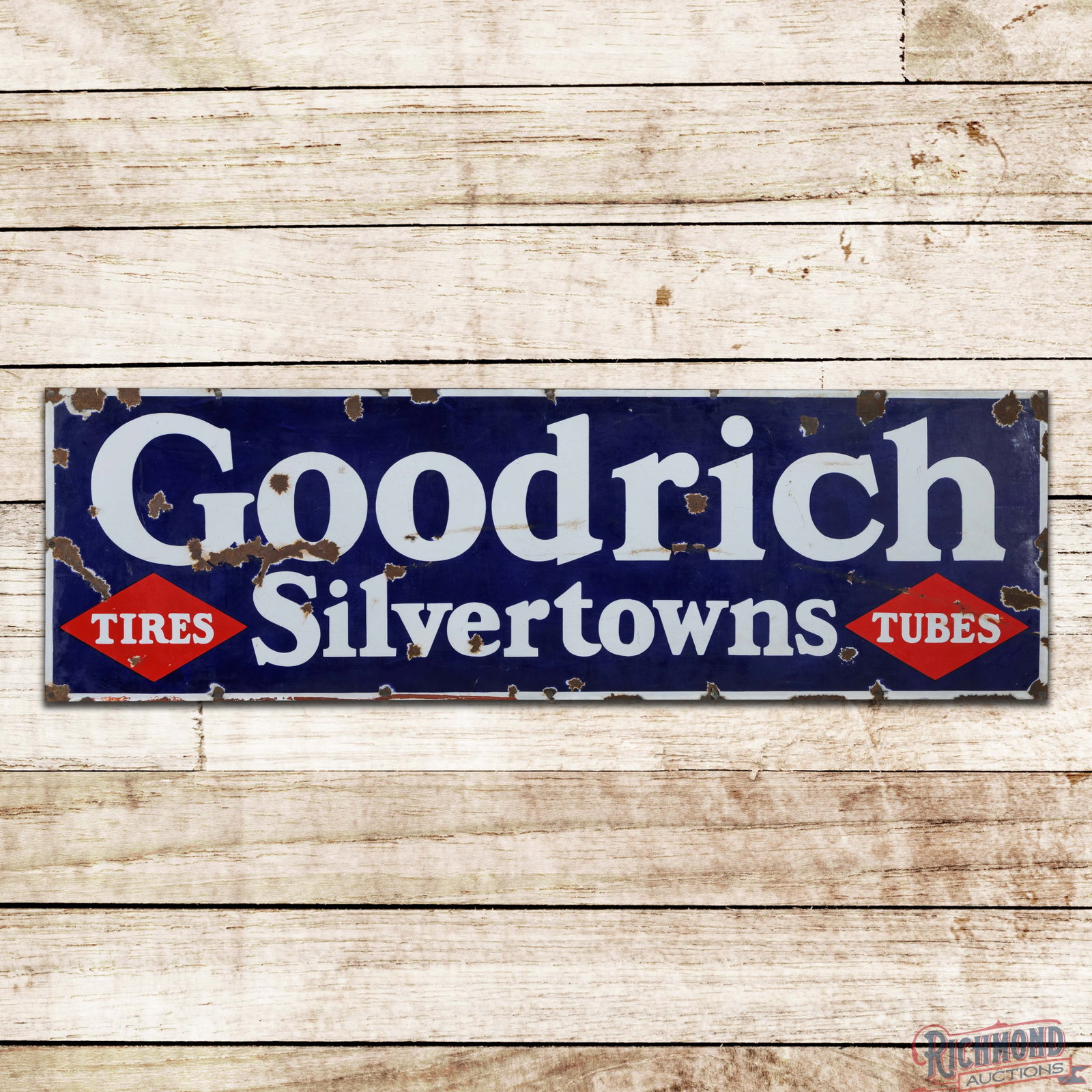 Goodrich Silvertowns Tires Tubes 5' Single Sided Porcelain Sign: SSP (single sided porcelain) sign has good color and moderate gloss. The display has general wear with cloudiness to the blue porcelain enamel, chips, fine scratches and areas of crazing. The perimete
