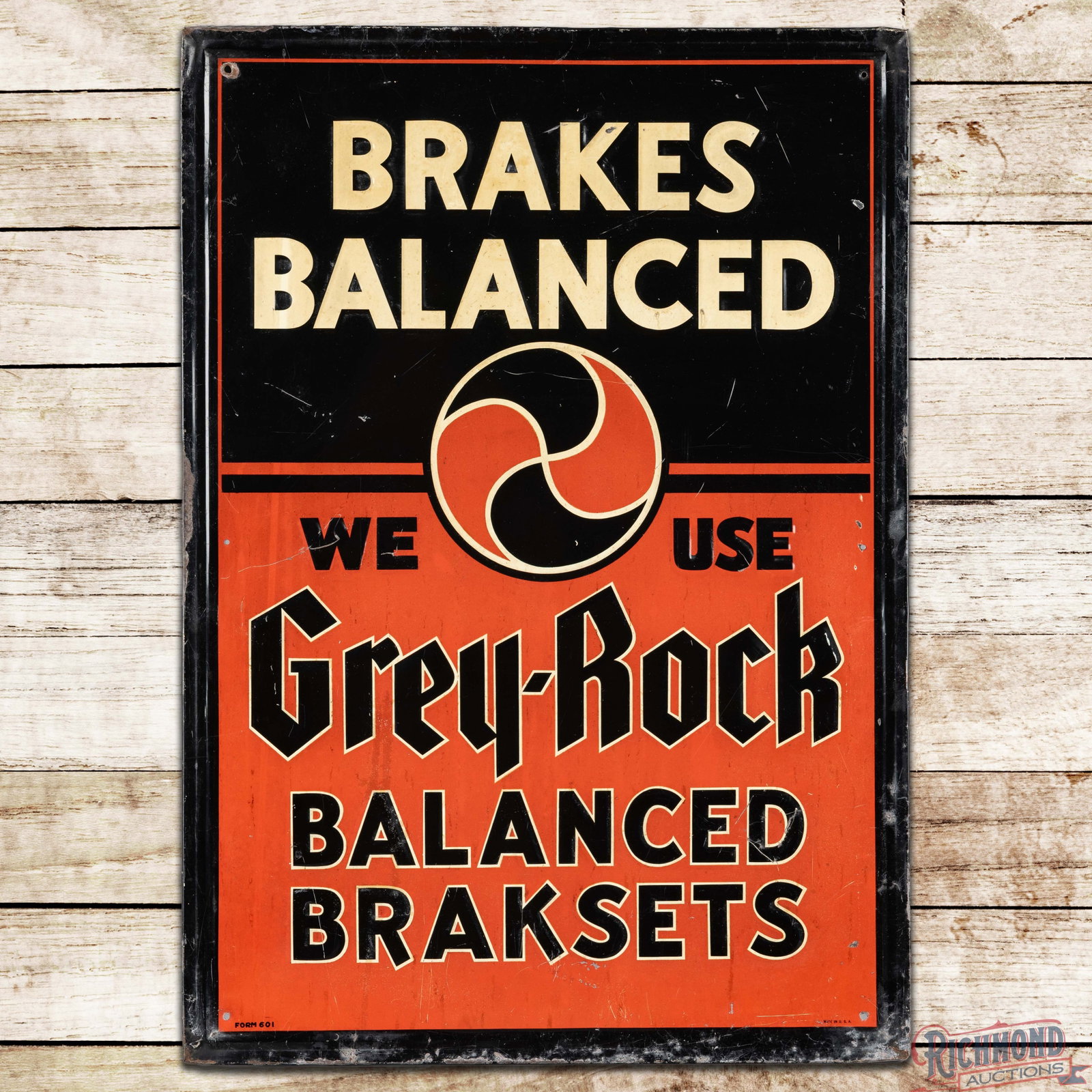 We Use Grey Rock Balanced Brakes Emb. Single Sided Tin Sign: SST (single sided tin) embossed self-framed sign has good color and shine. The field has fine scratches with areas of toning and discoloration. The perimeter has bends, paint chips and oxidation to th