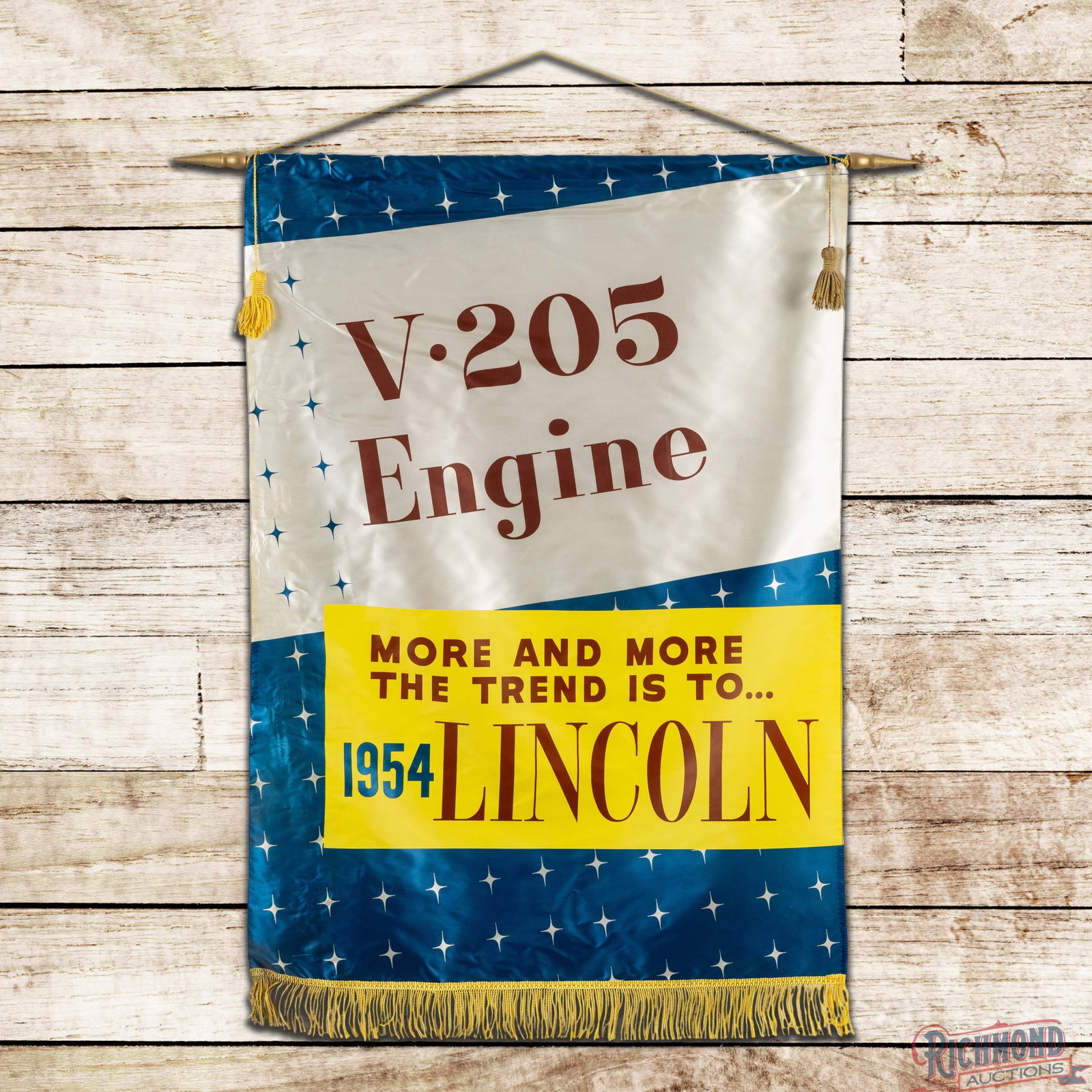 1954 Lincoln "V-205 Engine" Cloth Advertising Banner: Very clean throughout with minor wear along the perimeter. 44" H x 30.5" W. Condition: 9. All items are guaranteed authentic by Richmond Auctions unless otherwise noted. Purchases are eligible for fre