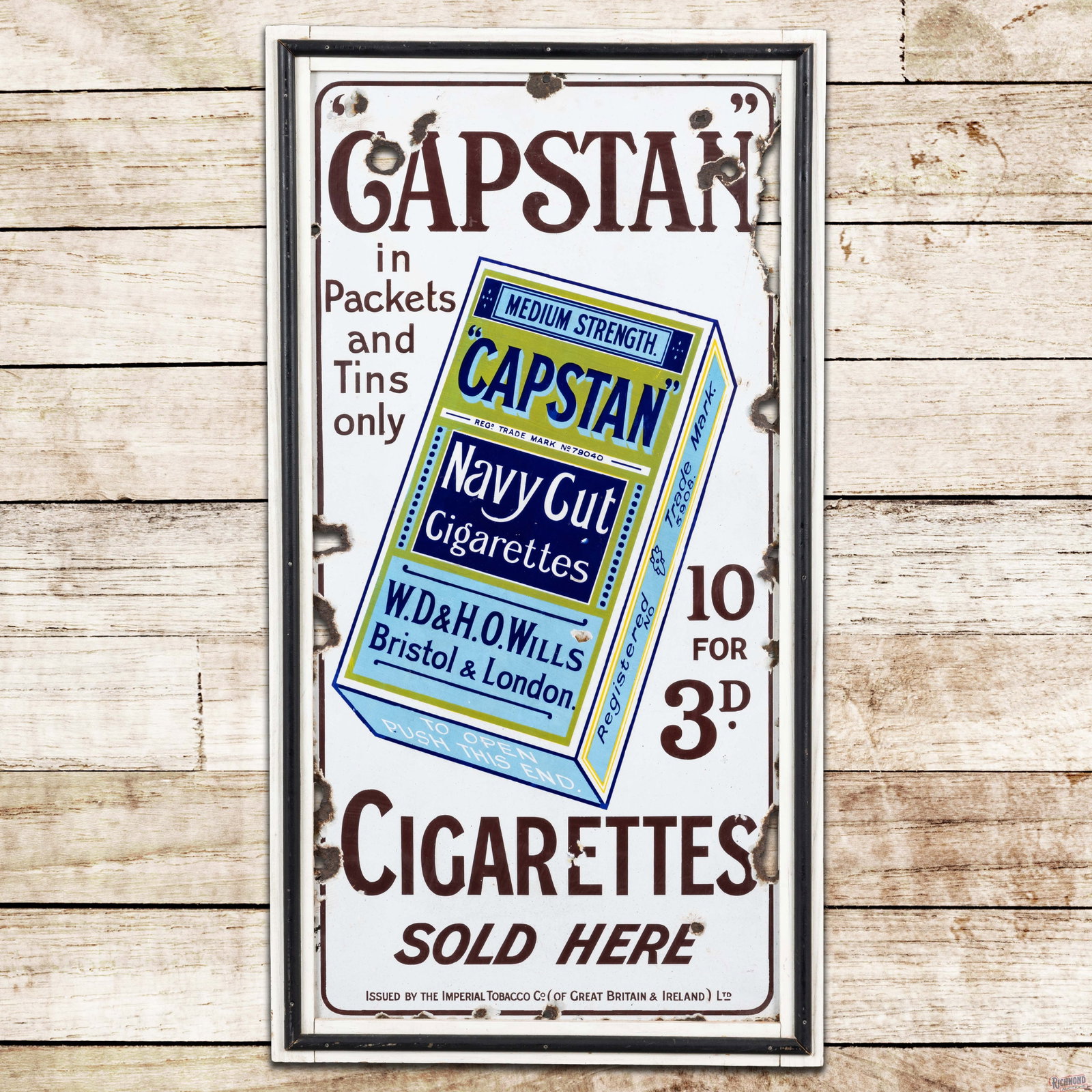 Capstan Navy Cut Cigarettes Sold Here 39" Single Sided Porcelain Sign: SSP (single sided porcelain) sign with an added wooden frame has very good color and gloss. The display has light wear with chips. The upper outer fields and the perimeter have non-factory holes with 