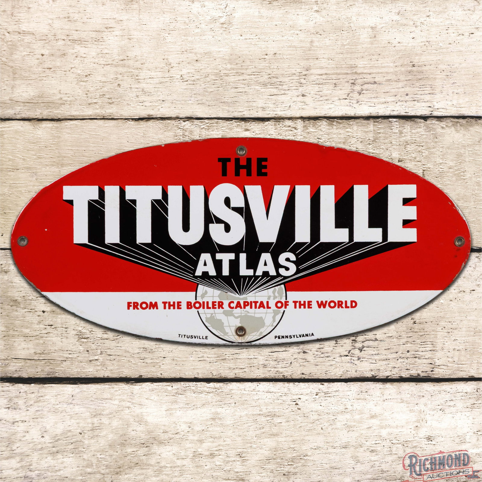 The Titusville Atlas "From the Boiler Capital of the World" 18" Single Sided Porcelain Sign: SSP (single sided porcelain) sign has excellent color and gloss. The field is clean with light surface wear and small factory blemish in the left outer field. The perimeter has minor discoloration wit