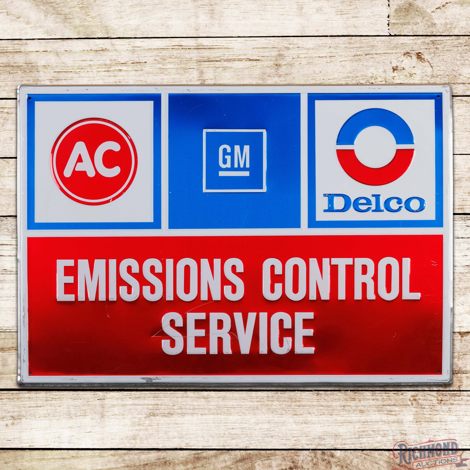 General Motors GM AC Delco Emissions Control Service Emb. 3' Single Sided Tin Sign w/ Logos: Single sided embossed self-framed metal sign has very good color and shine. The field has light wear with scratches. The perimeter has bends with areas of surface wear and paint chips to the self-fram