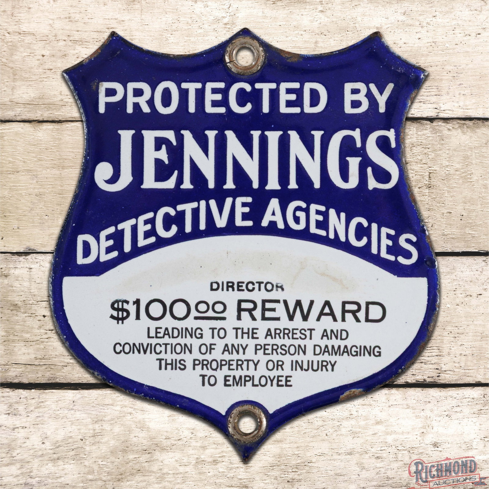 Protected By Jennings Detective Agency $100 Reward Single Sided Porcelain Shield Sign: SSP (single sided porcelain) sign has excellent color and gloss. The field has an areas of discoloration in the white porcelain enamel above the "Director" lettering. The perimeter has light wear with