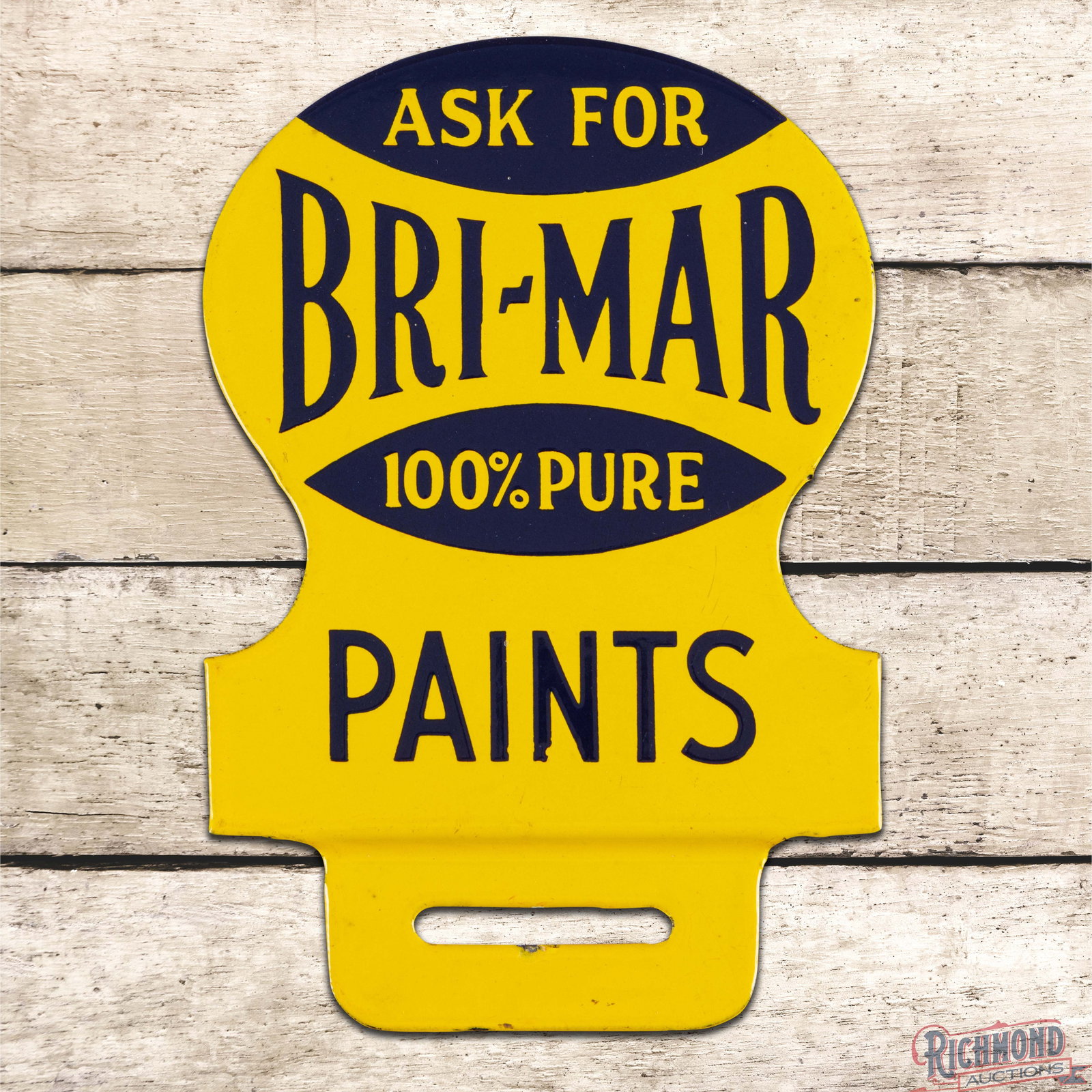 Ask for Bri-Mar 100% Pure Paints Single Sided Porcelain License Plate Attachment Sign: SSP (single sided porcelain) die cut license plate attachment has day one color and gloss. The field and perimeter are clean with a few small flea bites along the lower edges. Overall a fantastic exam