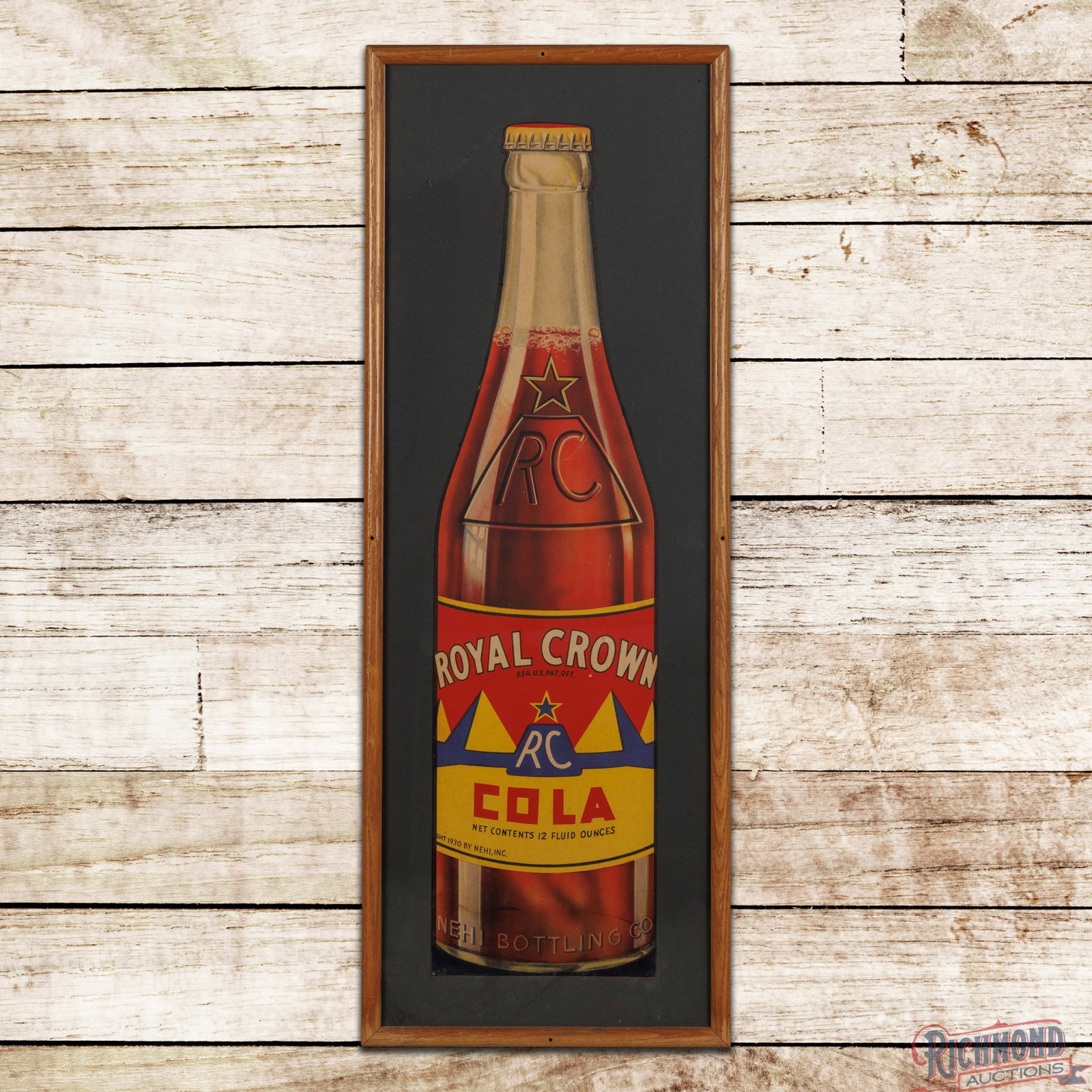 RC Royal Crown Cola Framed Die Cut SS Cardboard Bottle Sign: Single-sided die-cut cardboard sign has been framed under glass. The sign has light wear throughout with small scuffs, fine scratches and minor discoloration. The upper edge of the bottle has a bend, 