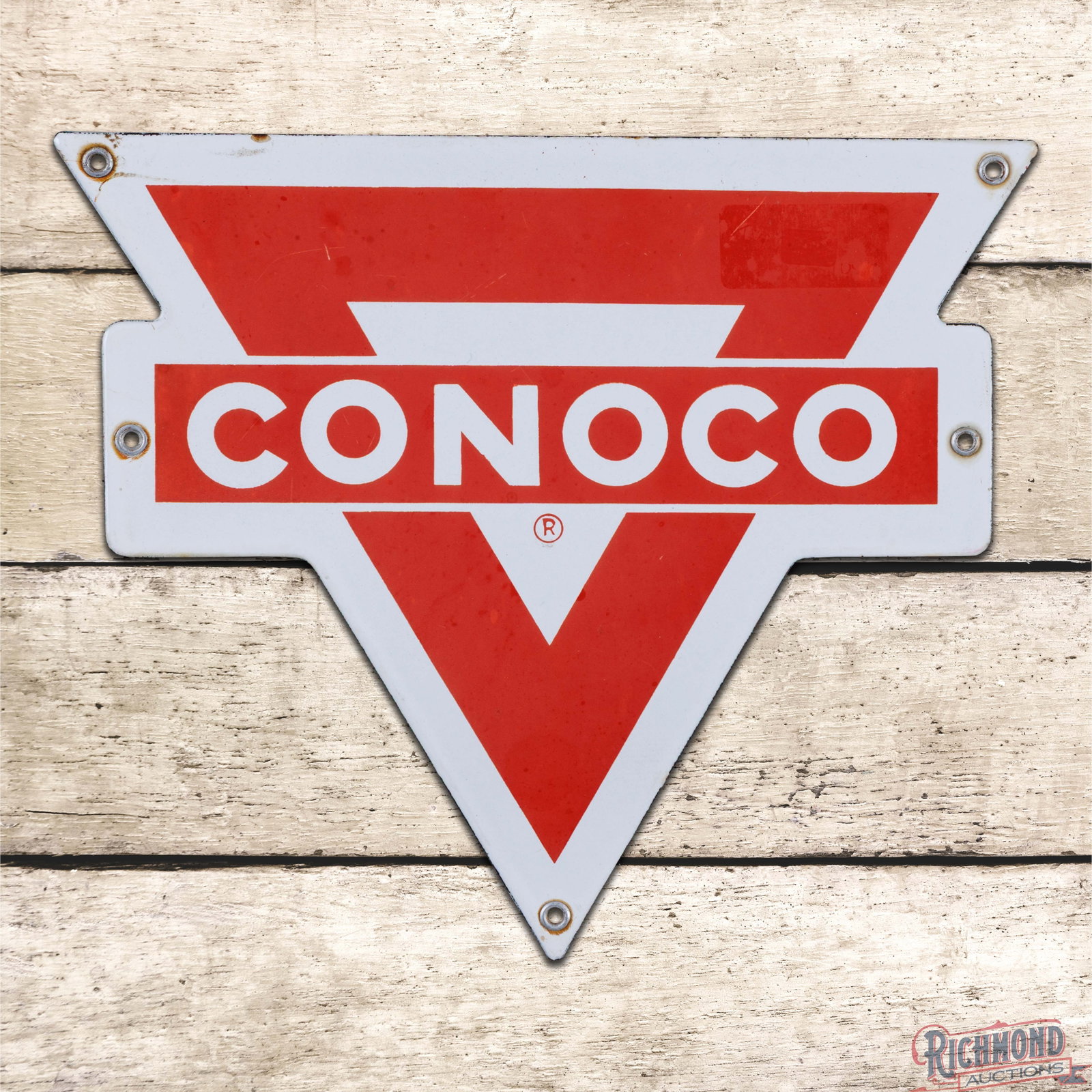 Conoco Single Sided Porcelain Die Cut Logo Sign: SSP (single sided porcelain) die cut sign has good color and moderate gloss. The red porcelain enamel has faded and an area of sticker residue is present in the upper right outer field. The perimeter 