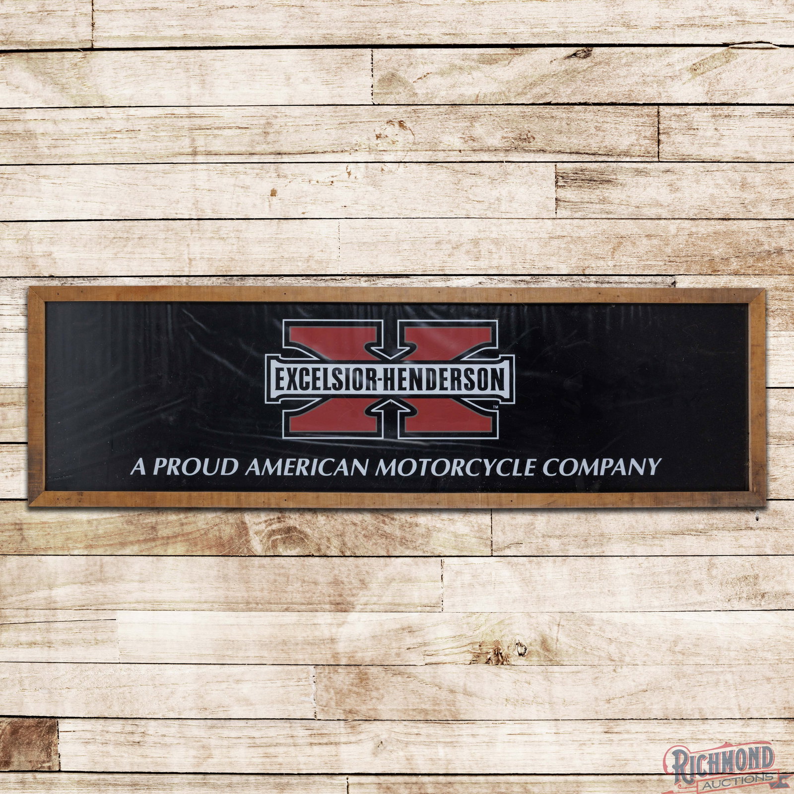 Framed Excelsior Henderson American Motorycle Company Vinyl Advertising Banner: Single sided vinyl banner has been framed under plexiglass. The banner has very good color with minor wrinkling, light wear, marks and trapped debris. The wooden frame is in very good condition, and t
