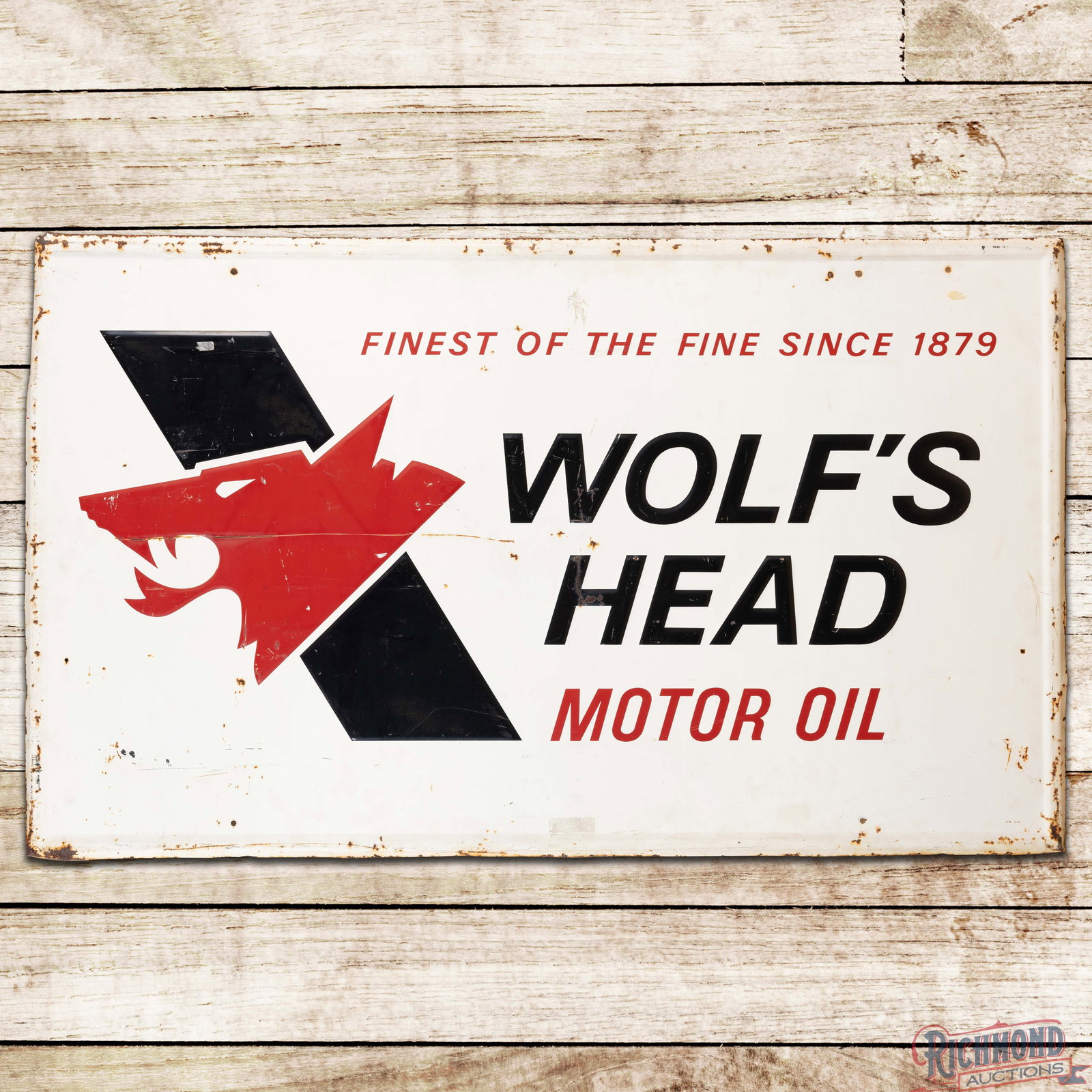 1975 Wolf's Head Motor Oil Emb. Single Sided Tin Sign: SST (single sided tin) embossed self-framed sign has good color and moderate shine. The field has general wear throughout with scratches, paint chips and oxidation. The perimeter has bends with additi