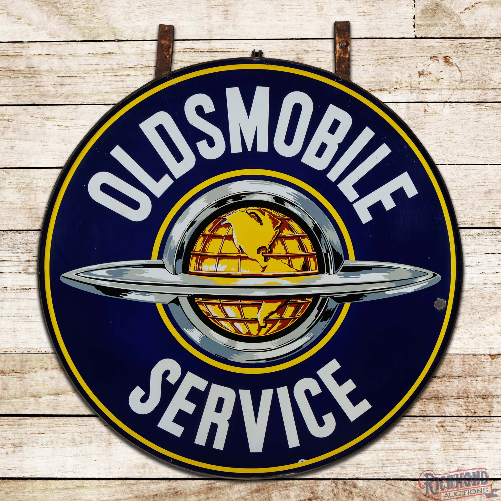 Oldsmobile Service 5' Double Sided Porcelain Sign w/ Ring "World Logo": DSP (double sided porcelain) sign with the factory hanging ring has excellent color and gloss. The display has light wear with chips in the outer fields and areas of small weld spatter areas in the up