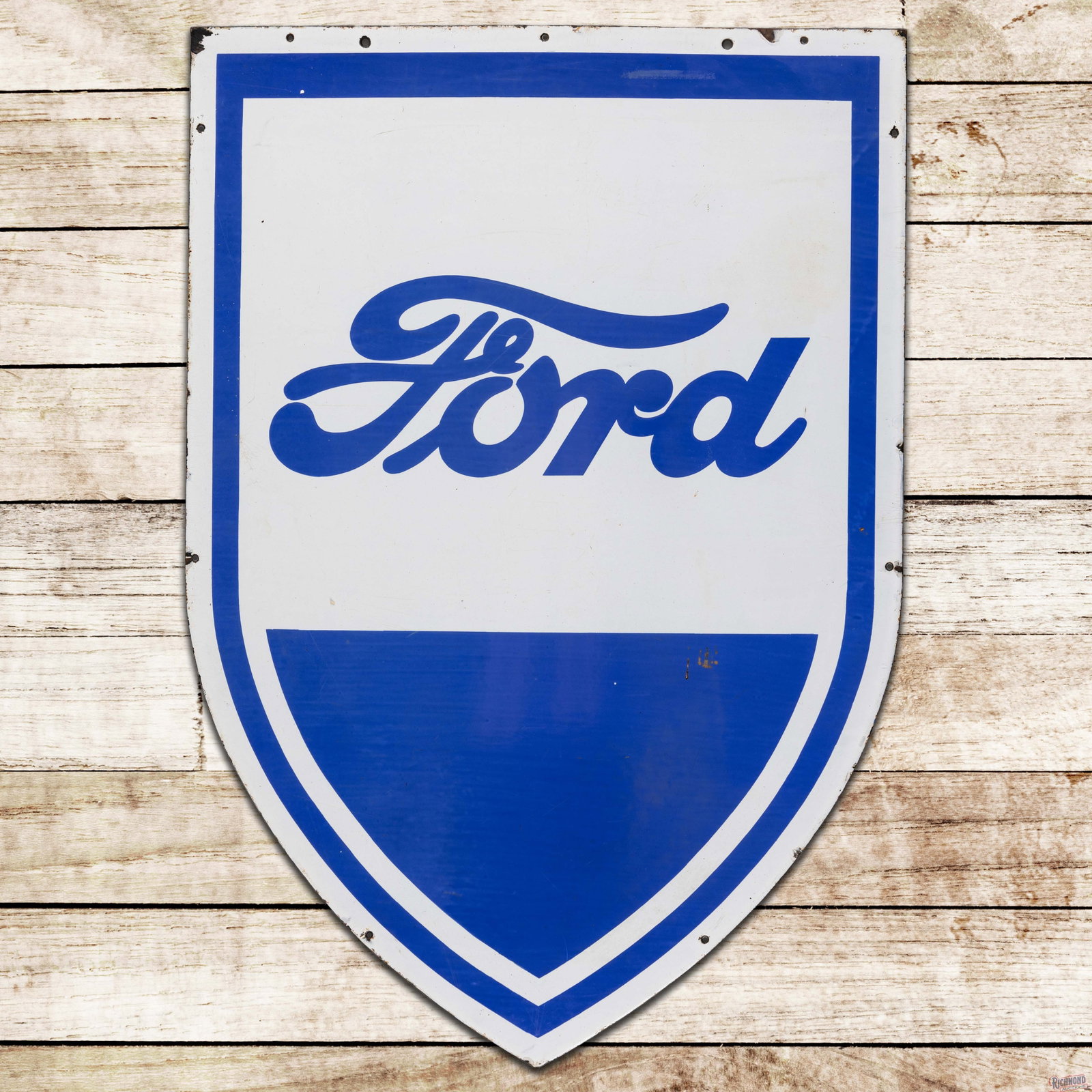 Ford Automobiles Dealership 41" Single Sided Porcelain Shield Sign: SSP (single sided porcelain) die cut sign has excellent color and gloss. The blue porcelain enamel is slightly cloudy throughout. The field exhibits fine scratches with a factory blemish in the lower 