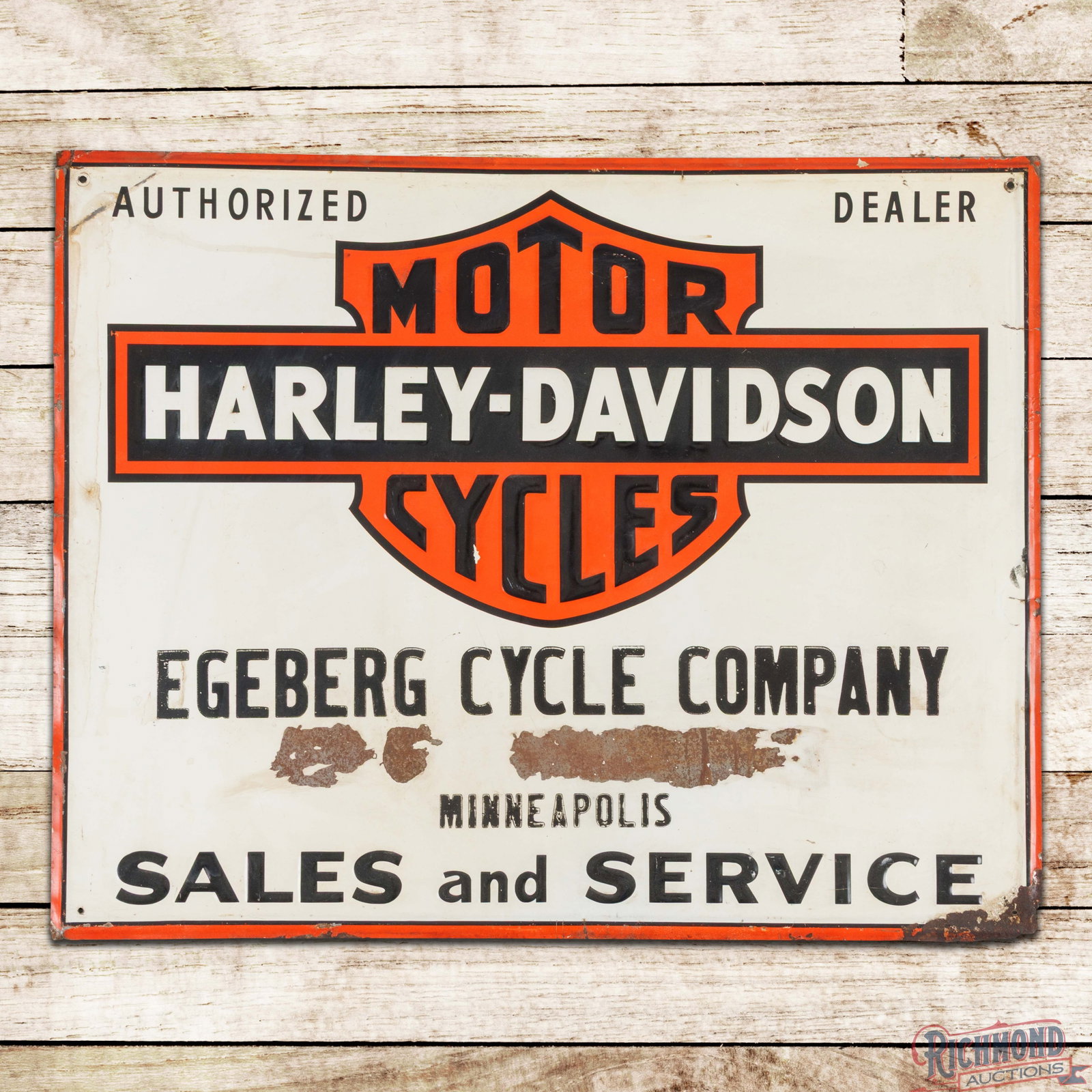 Harley Davidson Motor Cycles Authorized Dealer Sales Service Emb Tin Sign Egeberg Co. Minneapolis: SST (single sided tin) embossed self-framed sign has very good color and shine. The field has light wear with an errant paint drip in the "Y" of Cycles and a large area of paint loss in the lower fiel