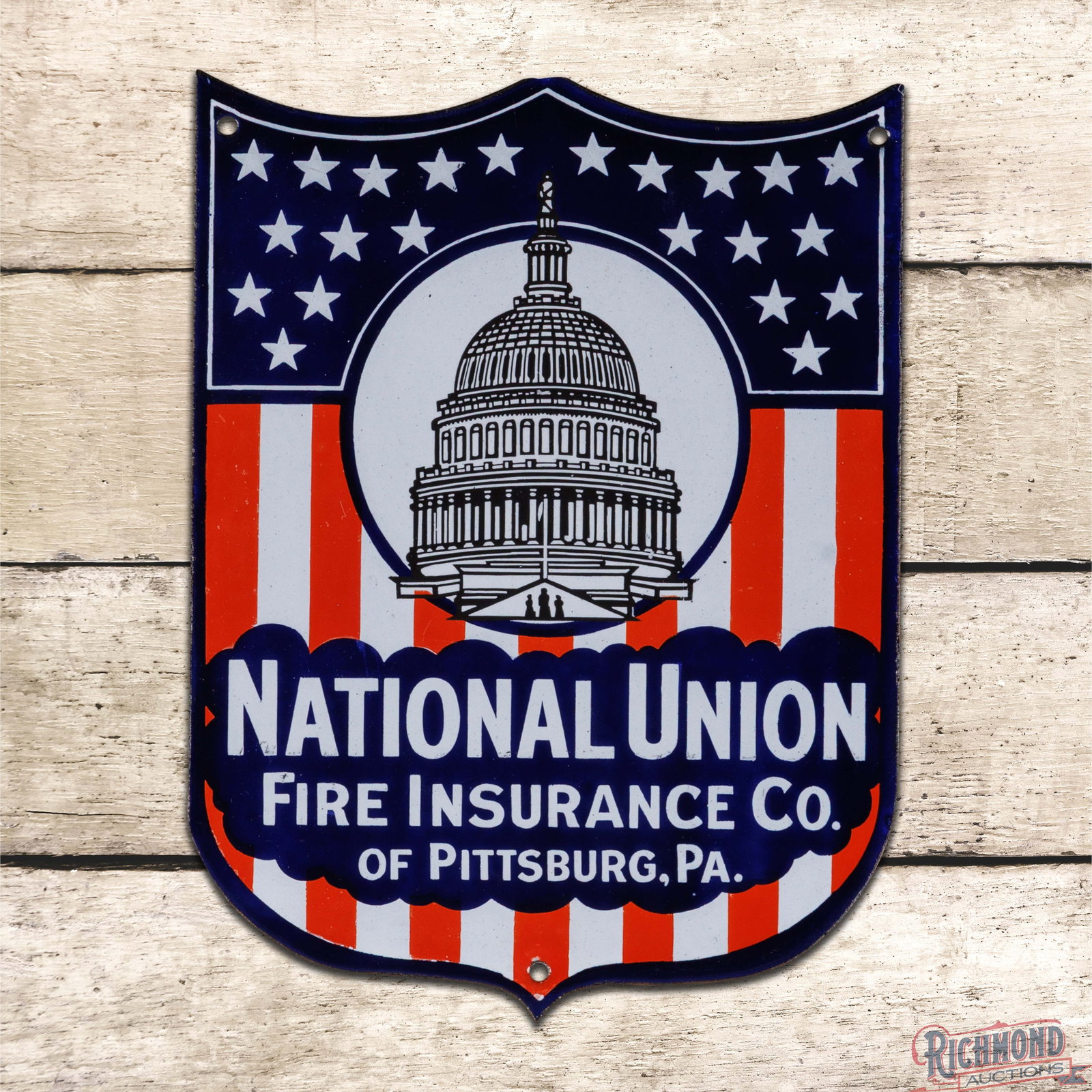 National Union Fire Insurance Co. of Pittsburgh PA Single Sided Porcelain Shield Sign w/ US Capitol: SSP (single sided porcelain) die cut shield sign has day one color and gloss. The sign features patriotic-themed colors with a detailed graphic of the US Capitol building. The field is exceptionally c